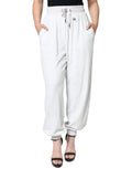 Pantalon de jogging en nylon blanc Dolce & Gabbana, style décontracté avec cordons à la taille et poches latérales.