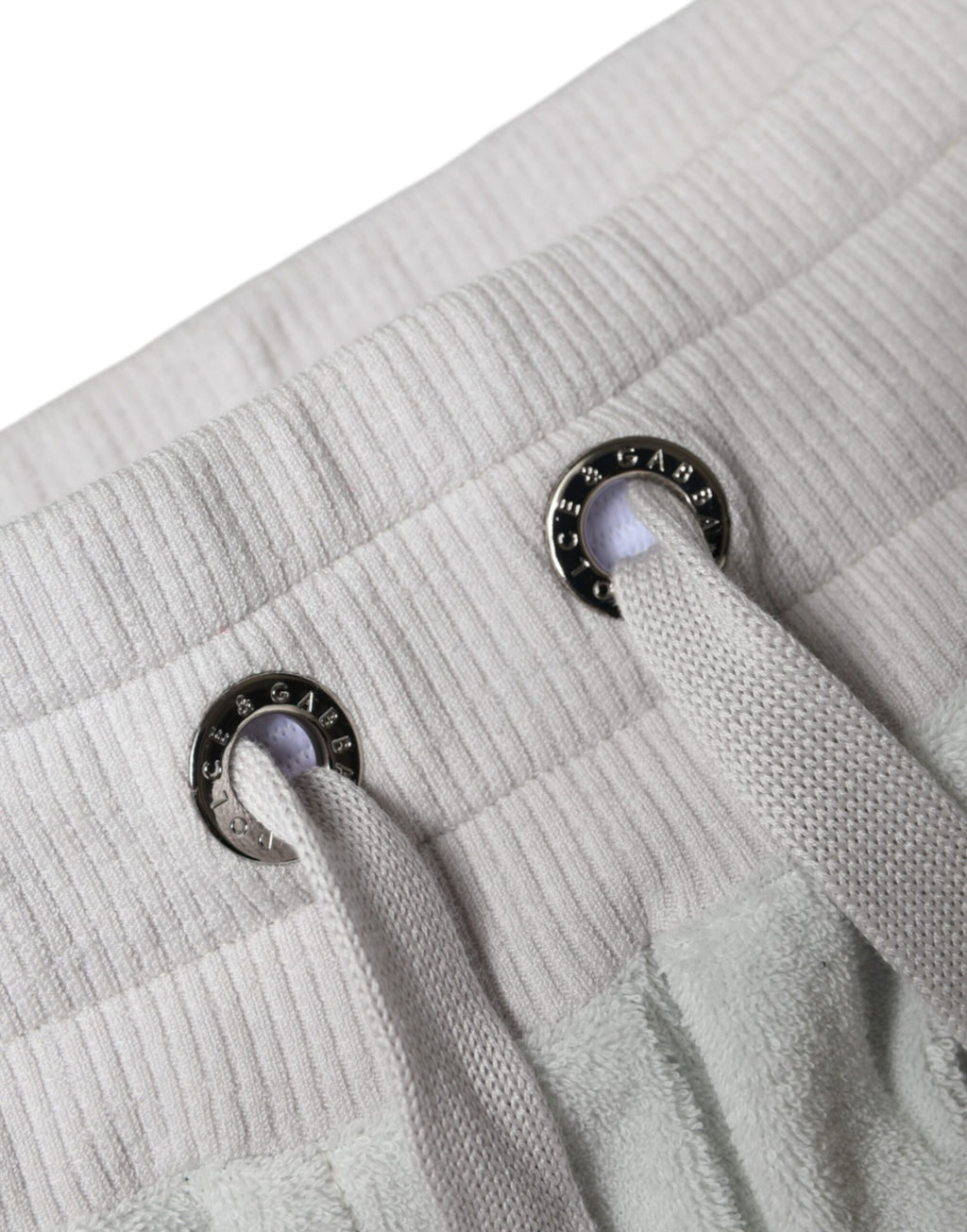 Pantalon jogging blanc en nylon Dolce & Gabbana, style décontracté, avec ceinture élastique et poches latérales.