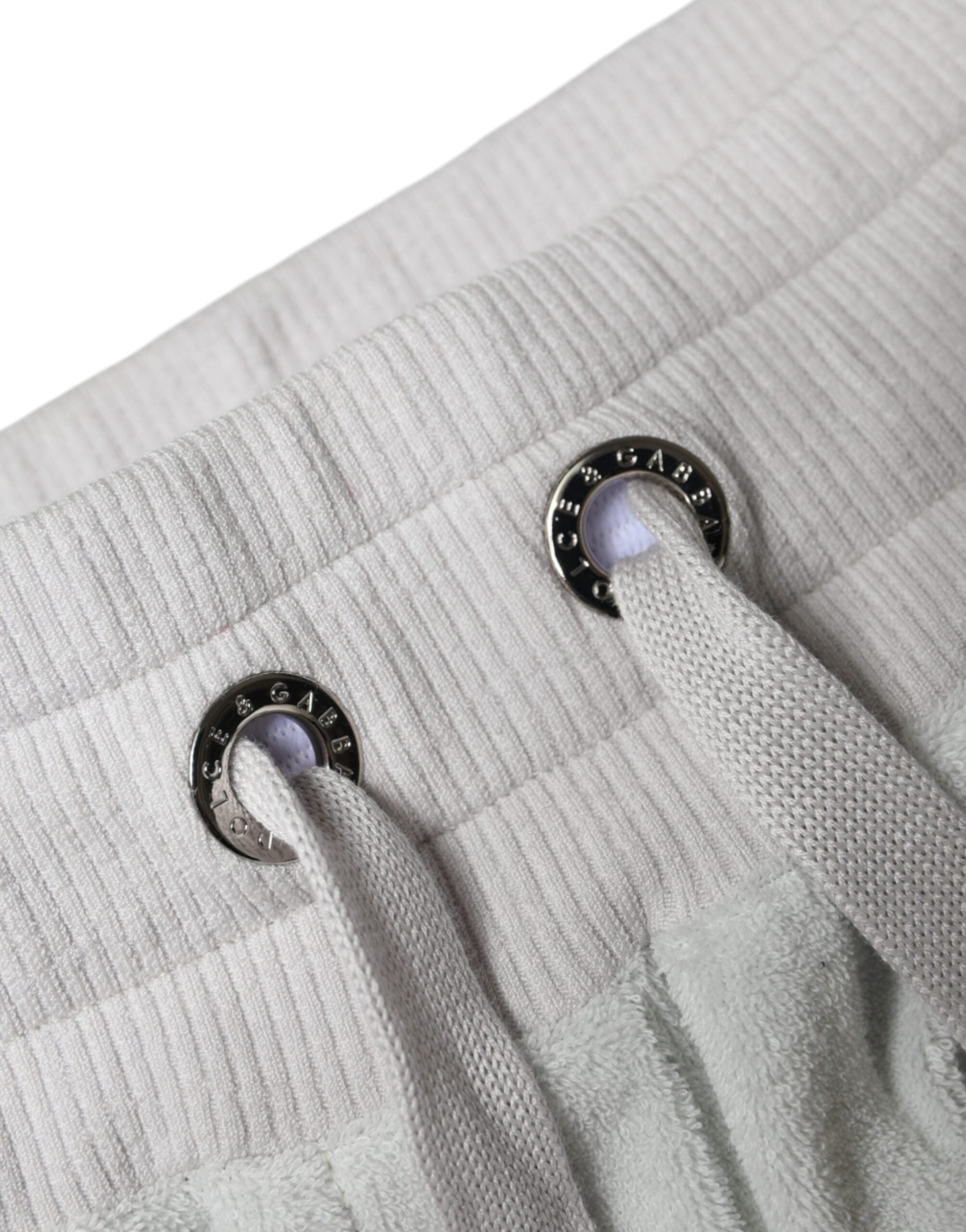 Pantalon jogging blanc en nylon Dolce & Gabbana, style décontracté, avec ceinture élastique et poches latérales.