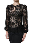 Top en dentelle florale noire à manches longues Dolce & Gabbana, see-through, avec détails élégants et transparence raffinée.