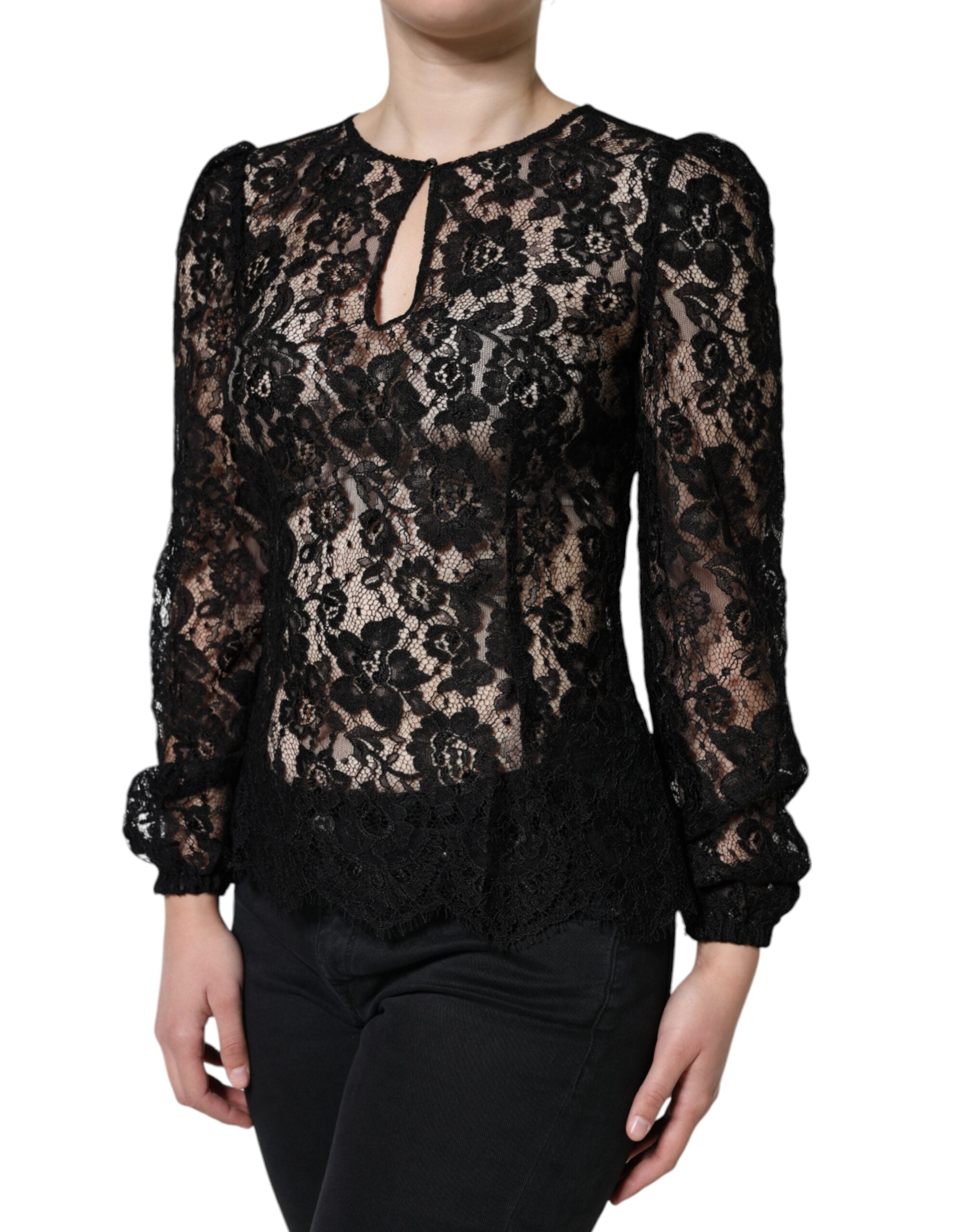 Top en dentelle florale noire à manches longues Dolce & Gabbana, see-through, avec détails élégants et transparence raffinée.