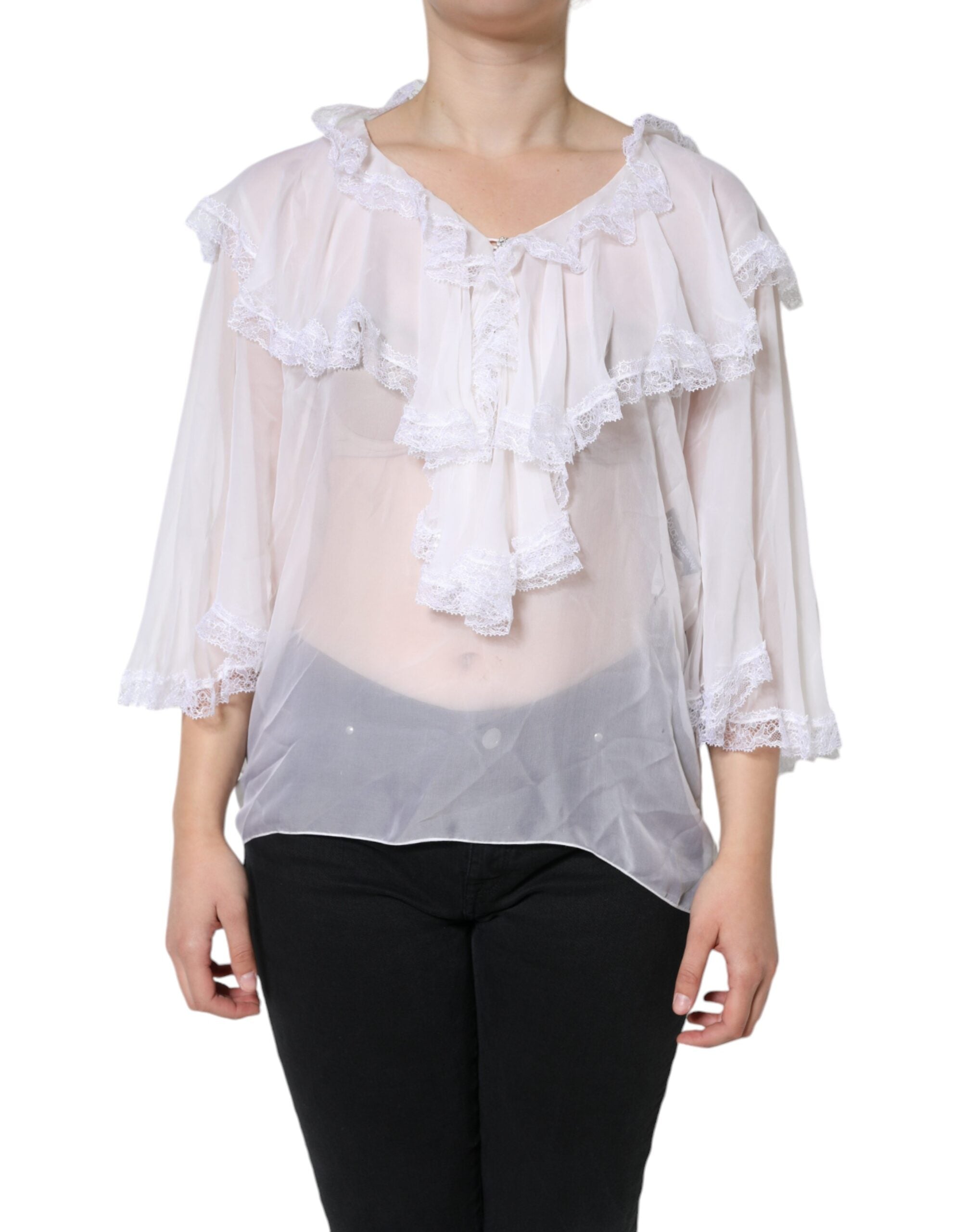 Blouse blanche en dentelle à volants à manches longues de Dolce & Gabbana, détails élégants et finition raffinée.