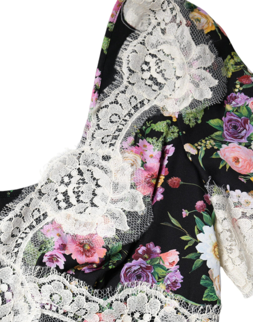 Blouse noire Dolce & Gabbana en dentelle florale à manches courtes, élégante et raffinée, vue de face.
