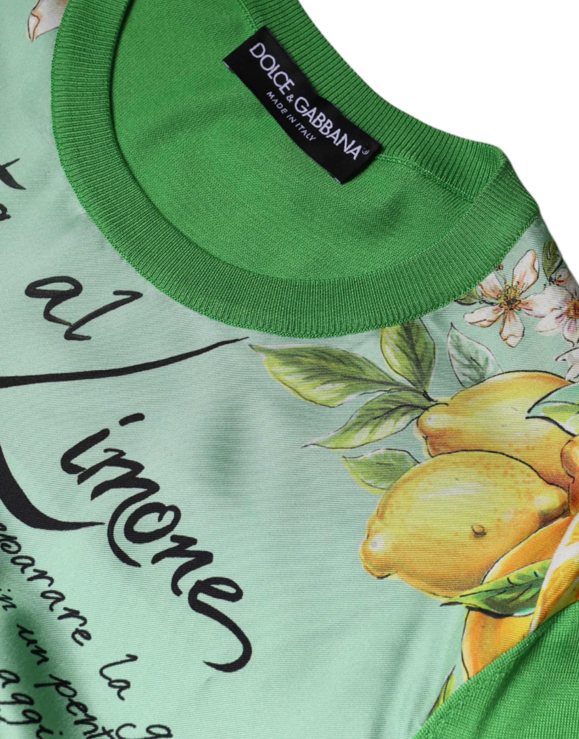 Pull Dolce & Gabbana en soie verte à manches longues avec motif Granita Al Limone, visible en détail sur l'image.