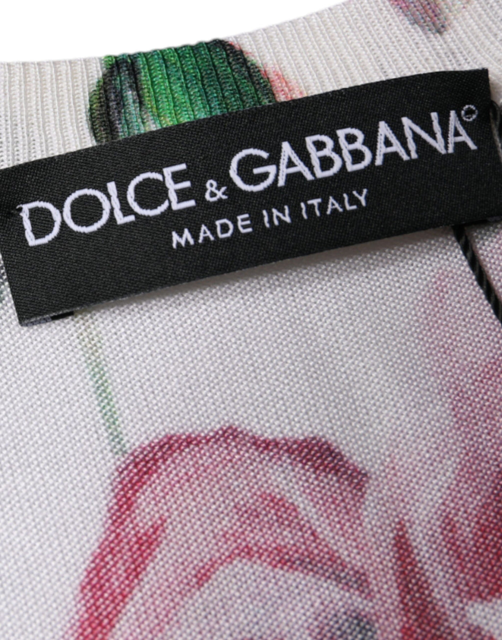 Top sans manches en soie blanche à fleurs en dentelle de Dolce & Gabbana, détails délicats et style élégant.