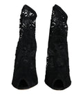 Chaussures Dolce & Gabbana talons en dentelle noire, bottines mi-mollet élégantes avec stretch, vue de face.