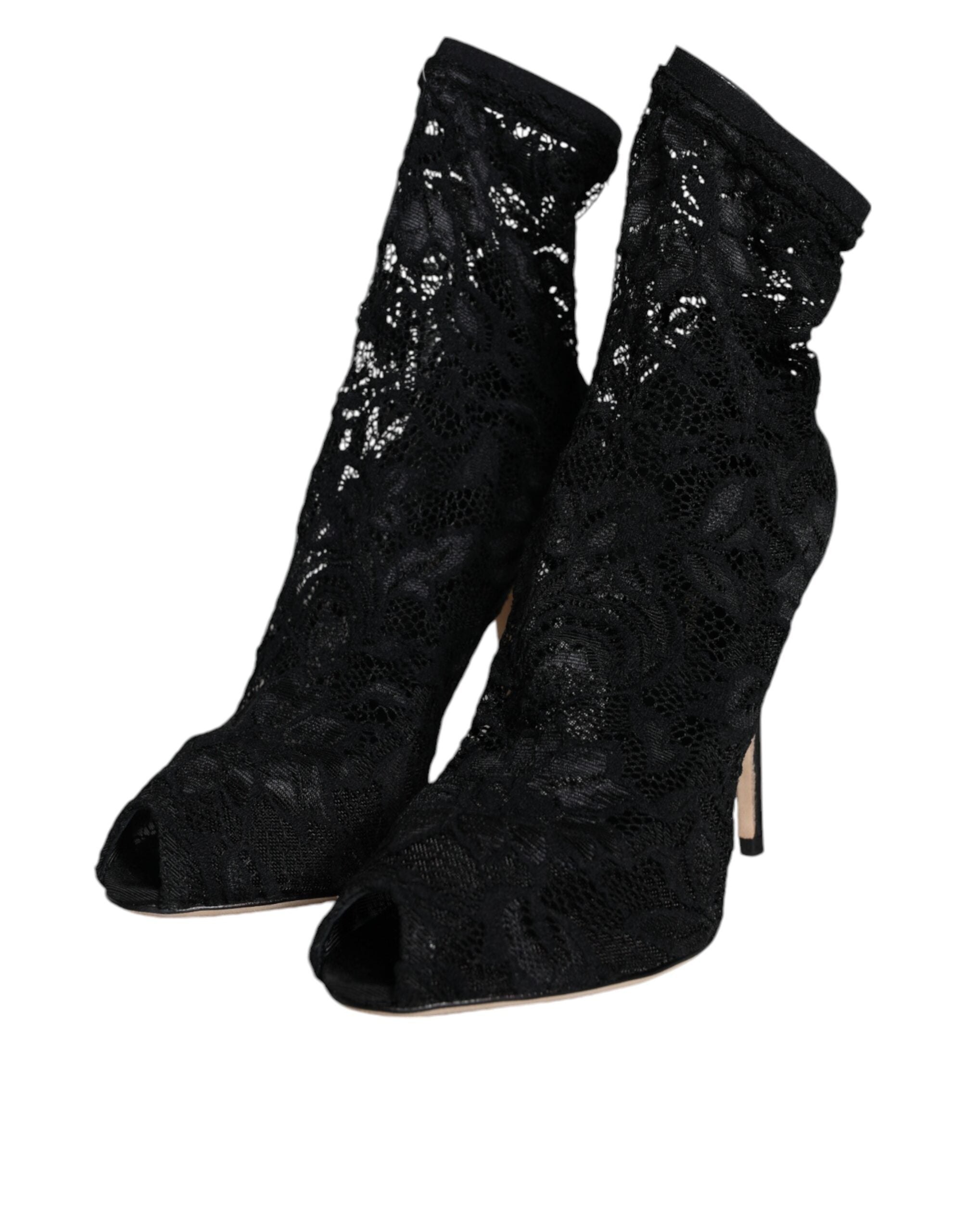 Chaussures Dolce & Gabbana à talons, bottines en dentelle noire extensible et mi-mollet, élégantes et sophistiquées.