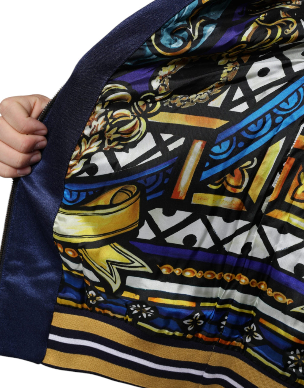 Pull Dolce & Gabbana à rayures bleues avec broderie d'abeille royale et écusson héraldique, doux et élégante.