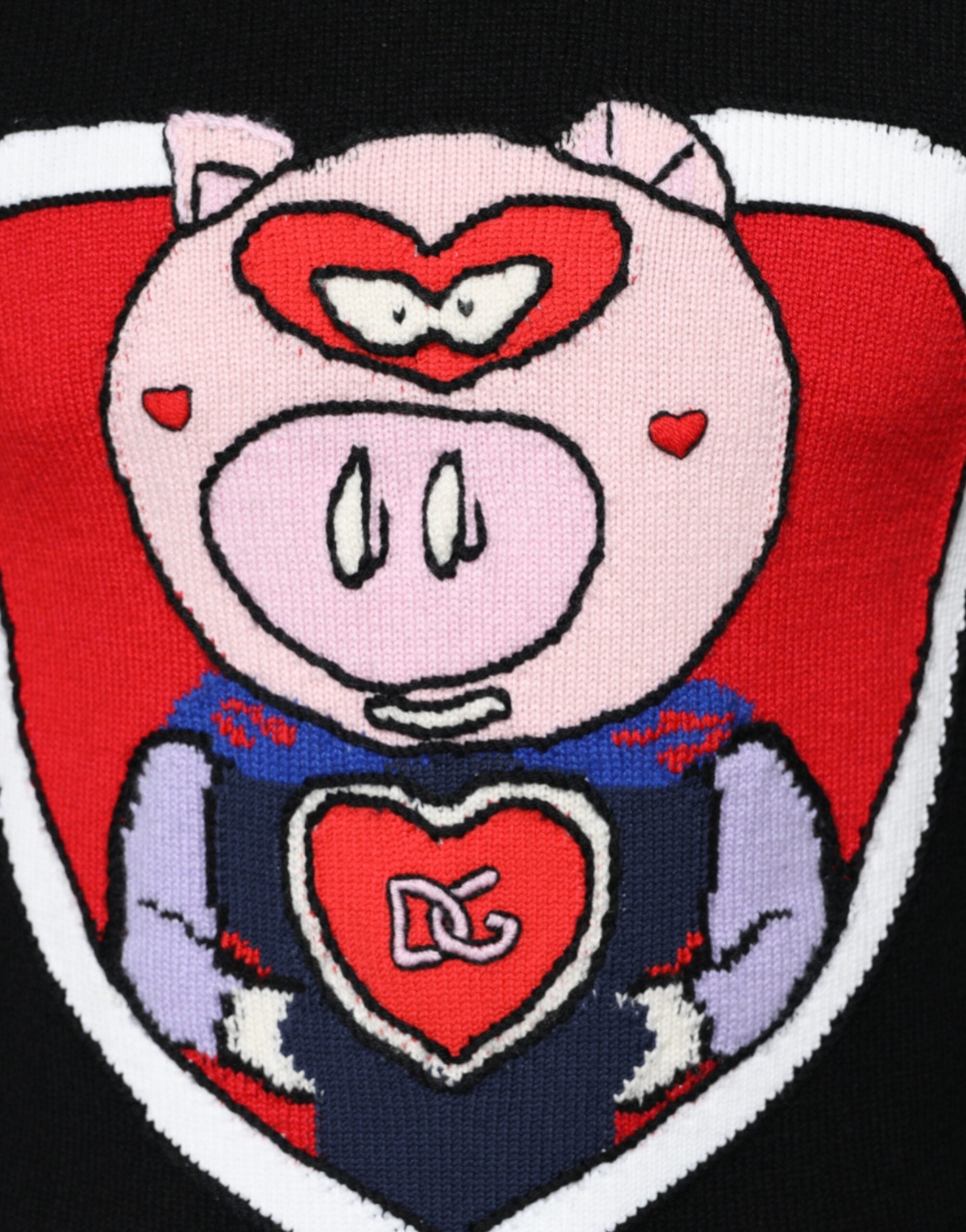 Pull Dolce & Gabbana en cachemire noir avec motif de cochon, élégant et chaud, idéal pour un style sophistiqué.