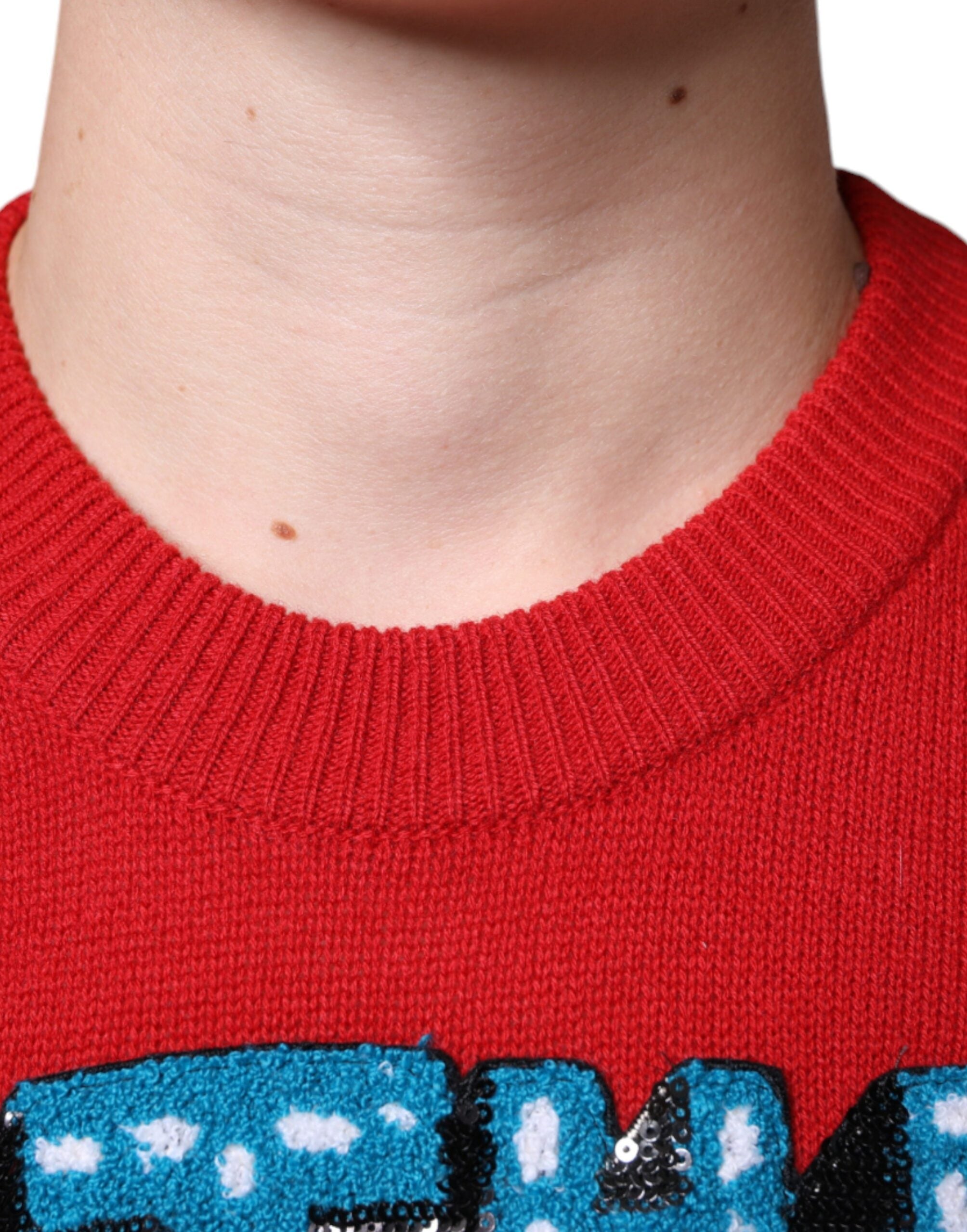 Sweatshirt en laine rouge Dolce & Gabbana "I'm The King" à col rond, style décontracté et logo visible.
