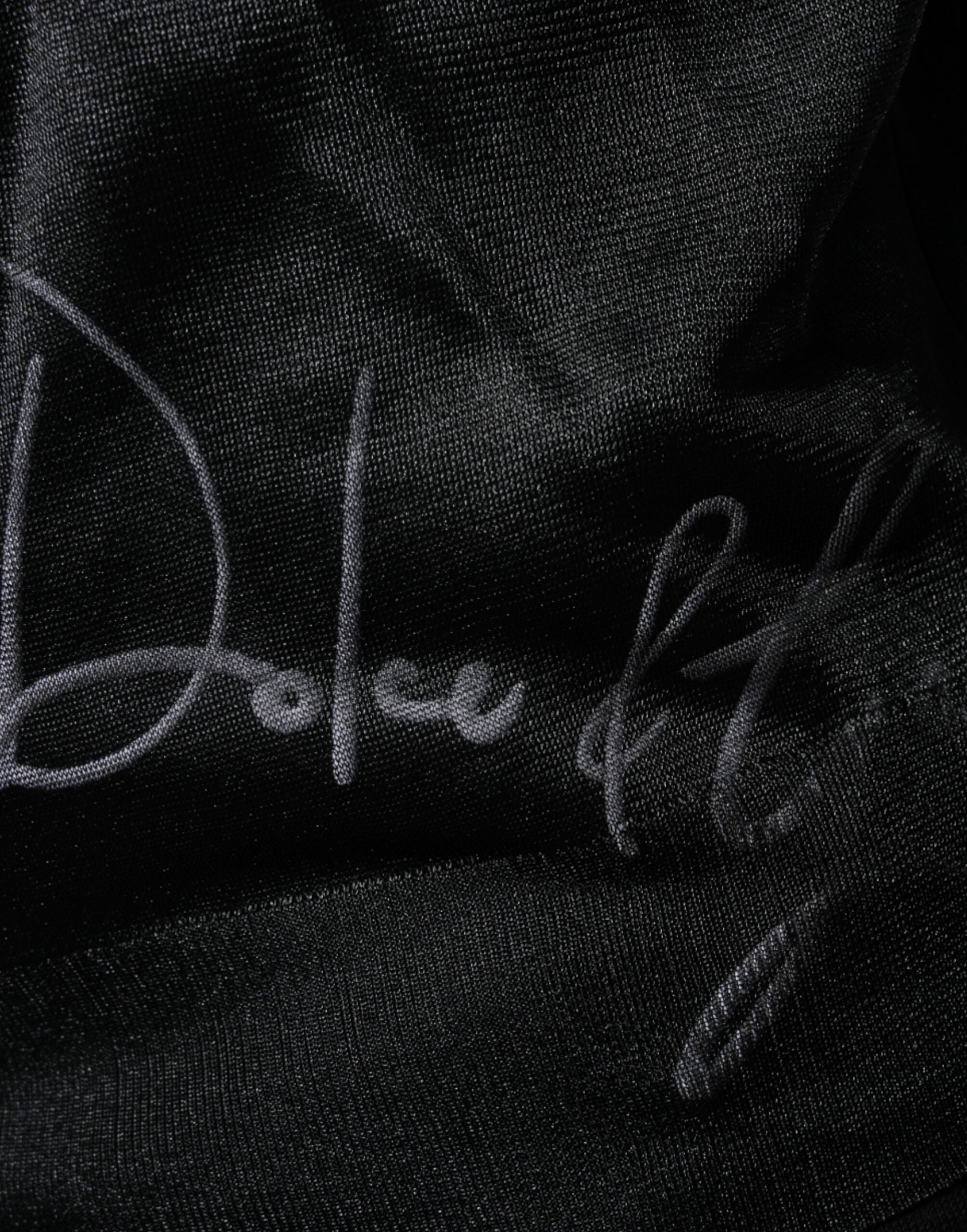Sweat-shirt noir en polyester de Dolce & Gabbana, pull-over décontracté avec col rond et logo discret visible sur le devant.