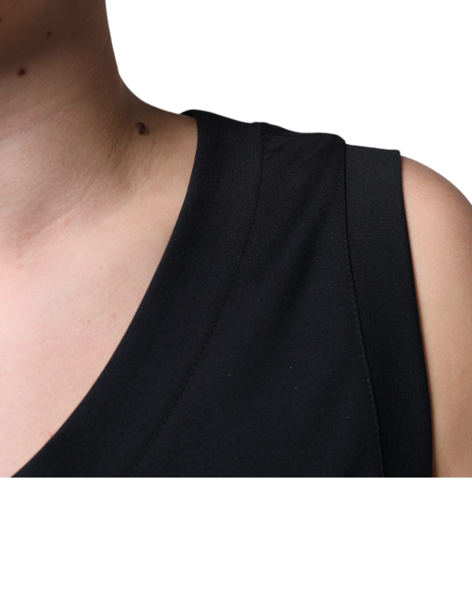 T-shirt sans manches noire Dolce & Gabbana en coton avec motif "Born To Be Free" visible sur le devant.