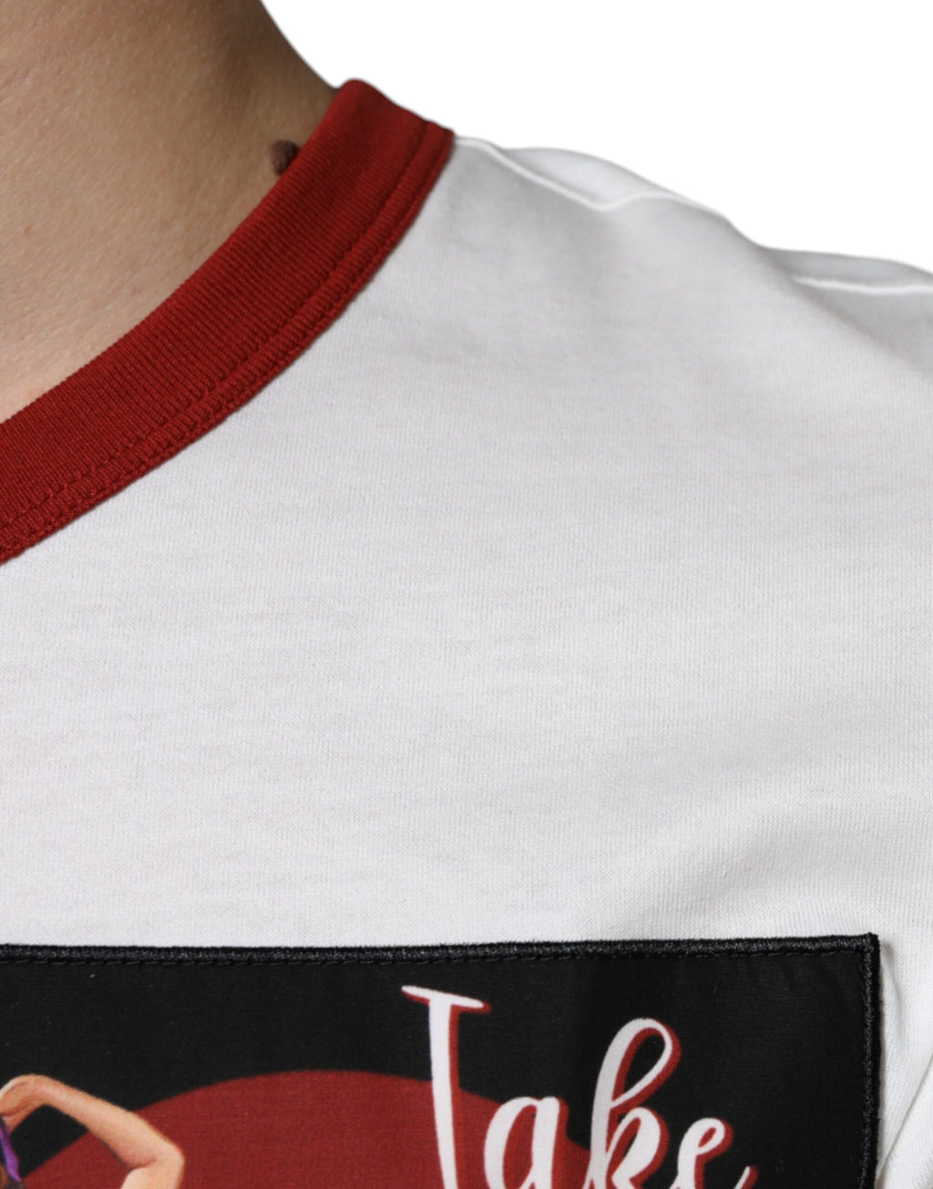 T-shirt blanc en coton Dolce & Gabbana avec motif graphique, col rond, visible sur l'image.