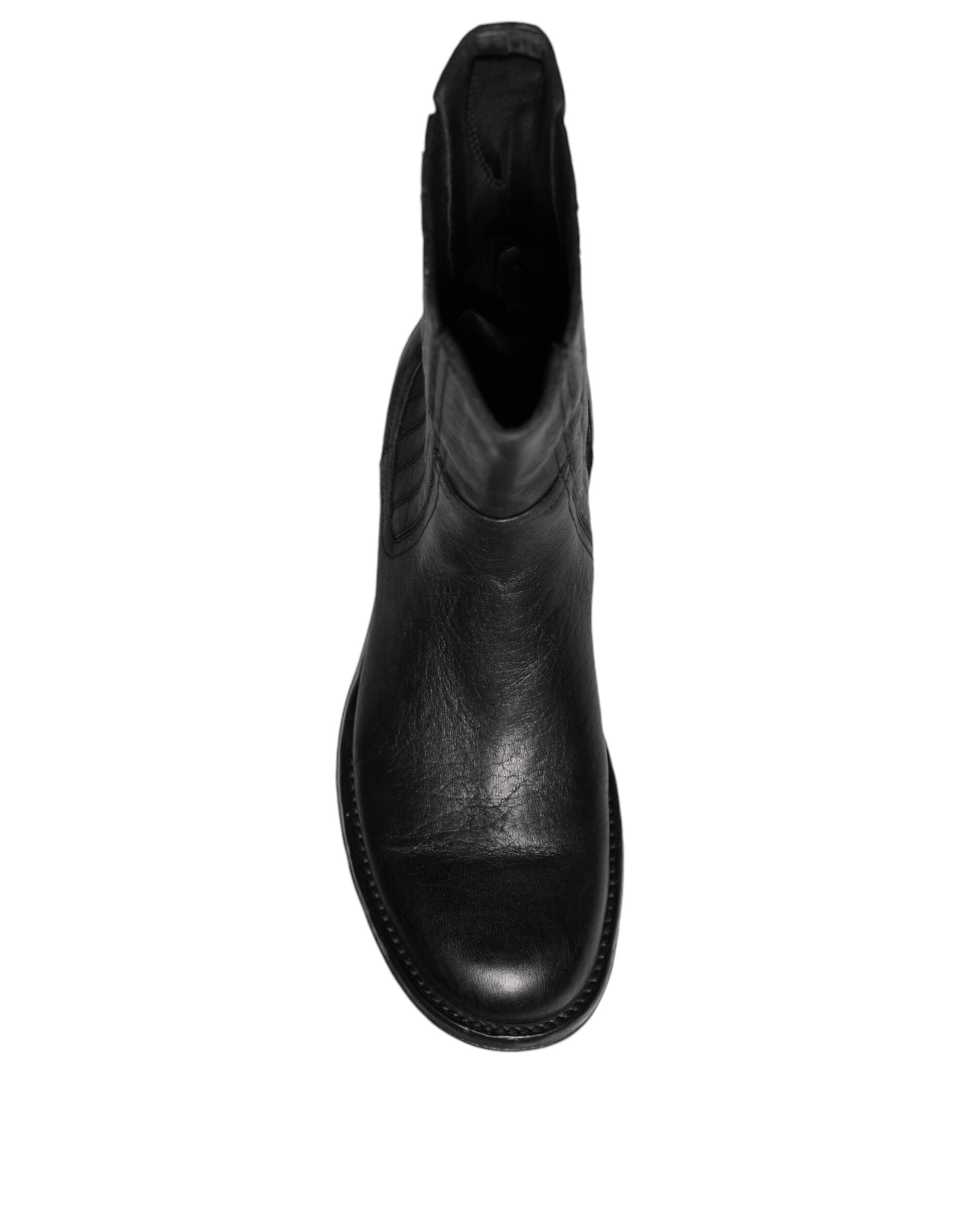 Bottes en cuir noir Dolce & Gabbana, mi-mollet, avec design élégant et finition raffinée, pour un style sophistiqué.