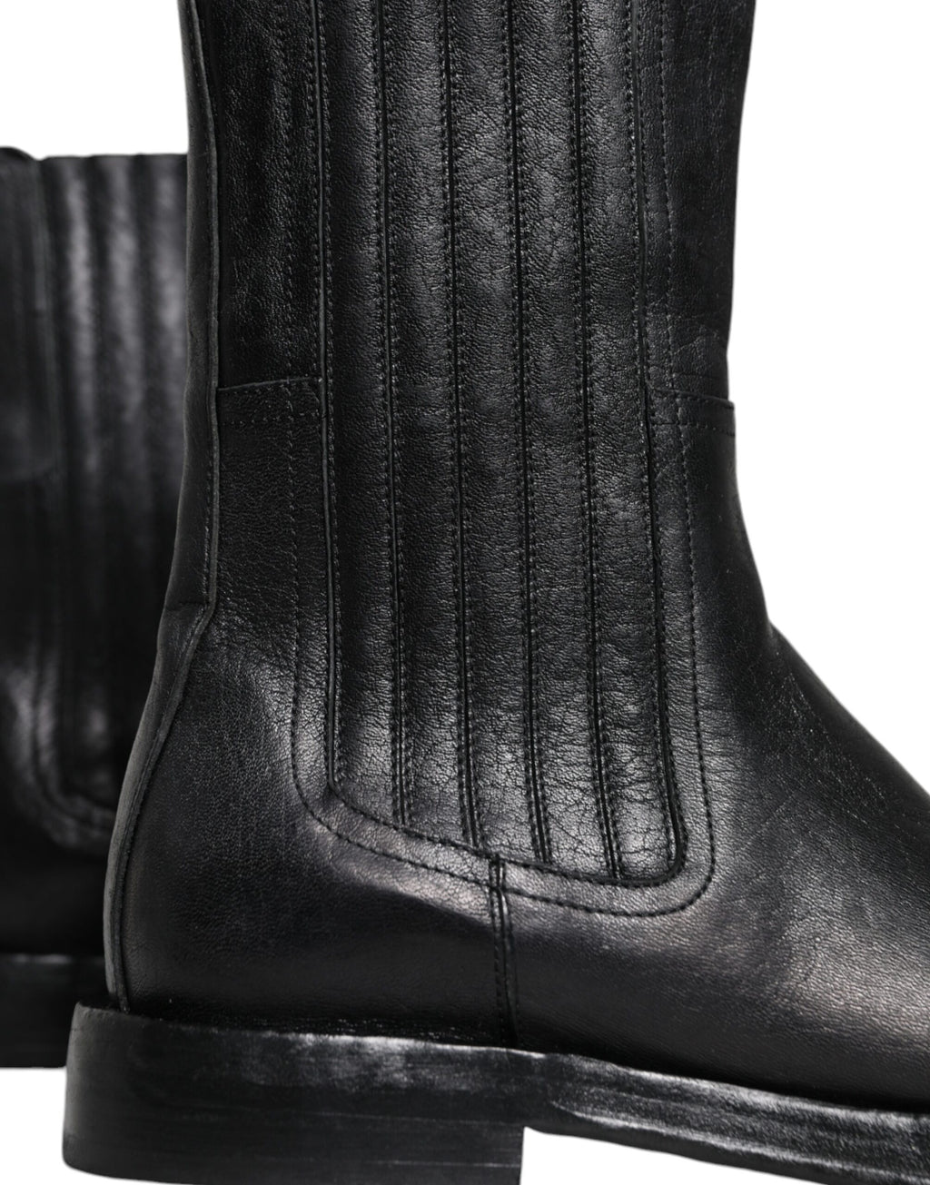 Bottes mi-mollet en cuir noir Dolce & Gabbana avec motif de cheval, élégantes et sophistiquées, pour femmes.