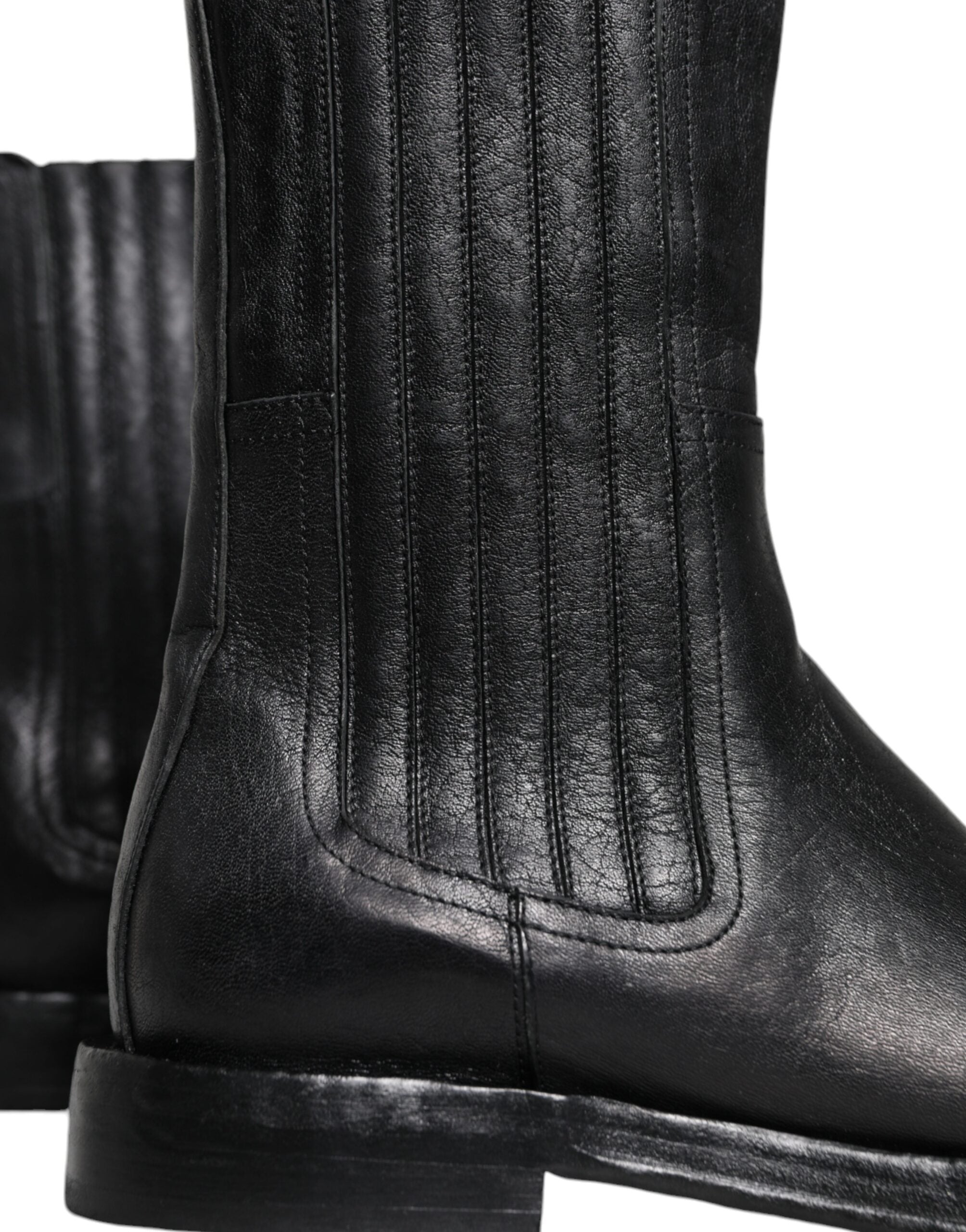 Bottes mi-mollet en cuir noir Dolce & Gabbana avec motif de cheval, élégantes et sophistiquées, pour femmes.