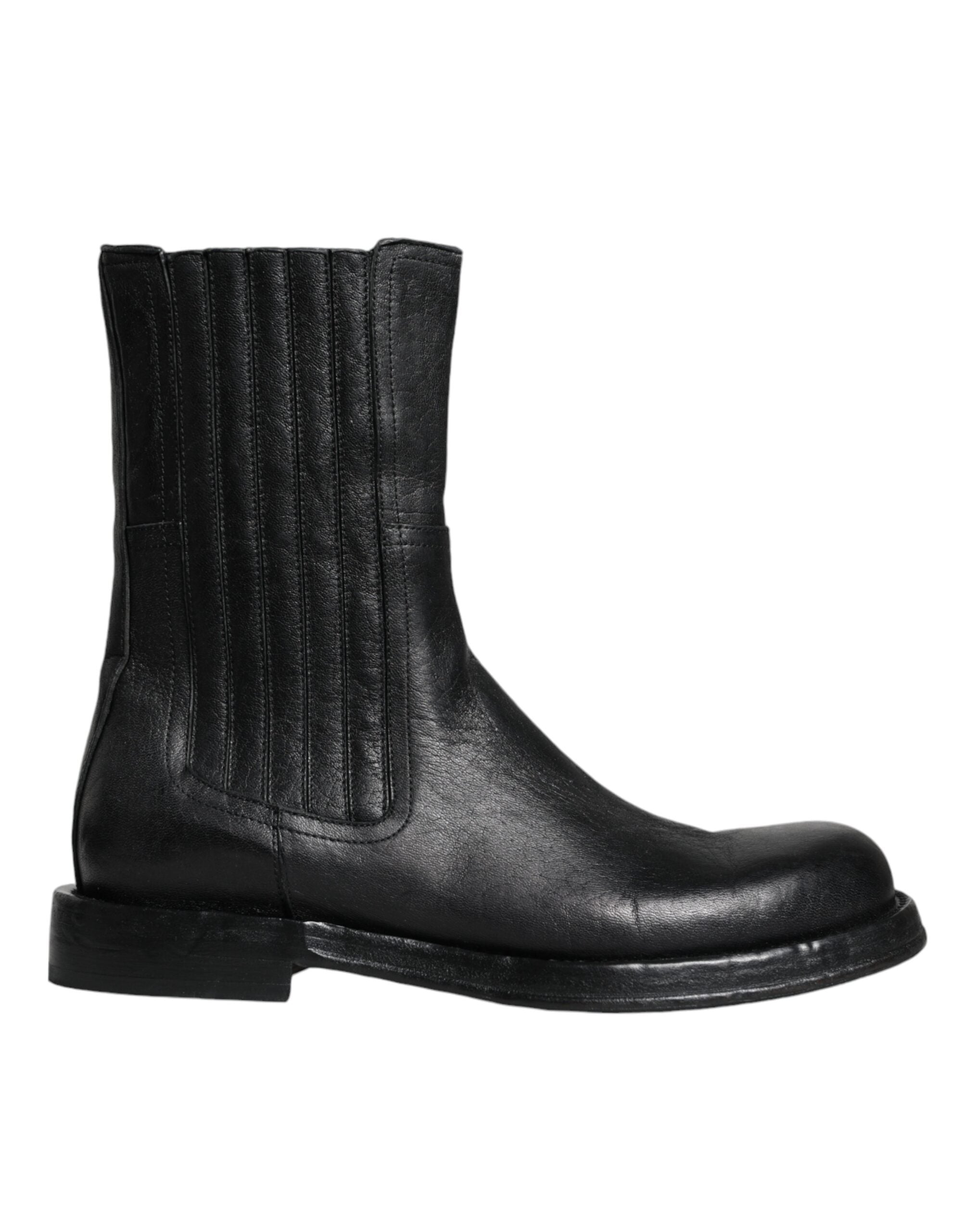 Bottes en cuir noir Dolce & Gabbana, mi-mollet, avec design élégant et détails sophistiqués, visibles sur cette image.