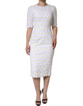 Robe midi en dentelle macramé blanche Dolce & Gabbana avec motif de marguerite, coupe ajustée et élégante.
