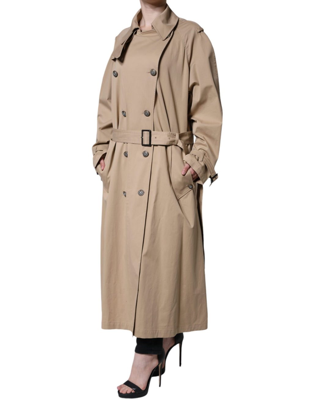 Manteau trench beige double-breasted Dolce & Gabbana pour femme, en tissu léger avec ceinture à la taille et boutons apparents.