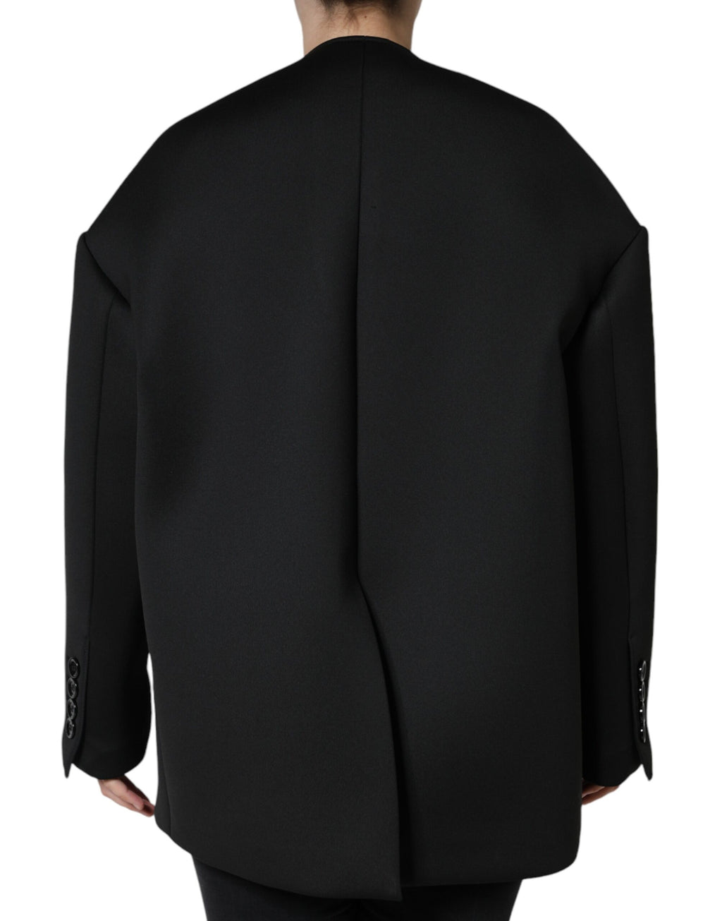 Manteau noir en polyester Dolce & Gabbana, à double boutonnage, style élégant et moderne, porté sur un mannequin.