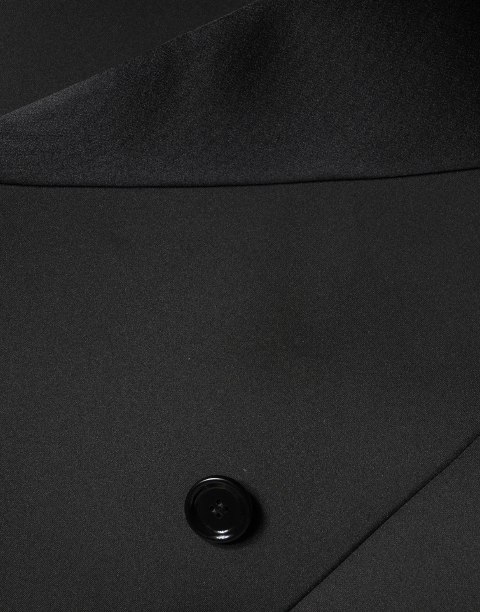 Manteau noir en polyester à double boutonnage de Dolce & Gabbana, veste élégante avec col et boutons devant.