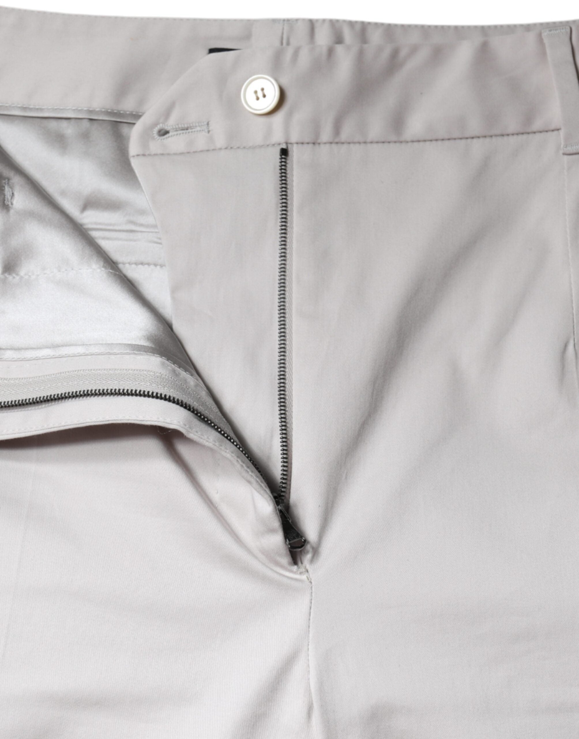 Pantalons skinny en coton blanc à taille moyenne de Dolce & Gabbana, coupe courte et ajustée, visible sur l'image.