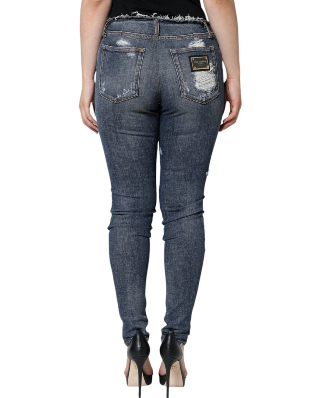Jeans skinny en coton extensible bleu Dolce & Gabbana avec déchirures et finition usée, mode tendance pour femmes.