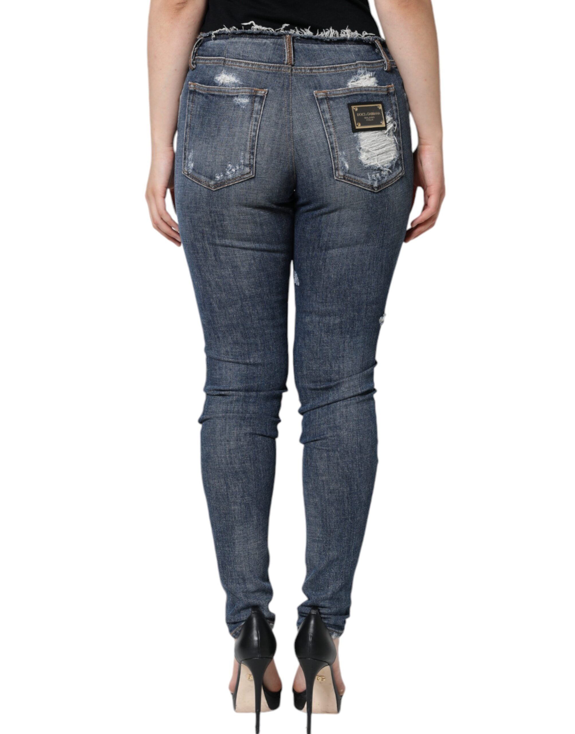 Jeans skinny en coton extensible bleu Dolce & Gabbana avec déchirures et finition usée, mode tendance pour femmes.