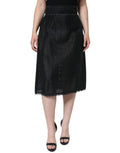 Jupe crayon noire en viscose à taille haute de Dolce & Gabbana, coupe élégante et ajustée, portée avec un haut blanc.