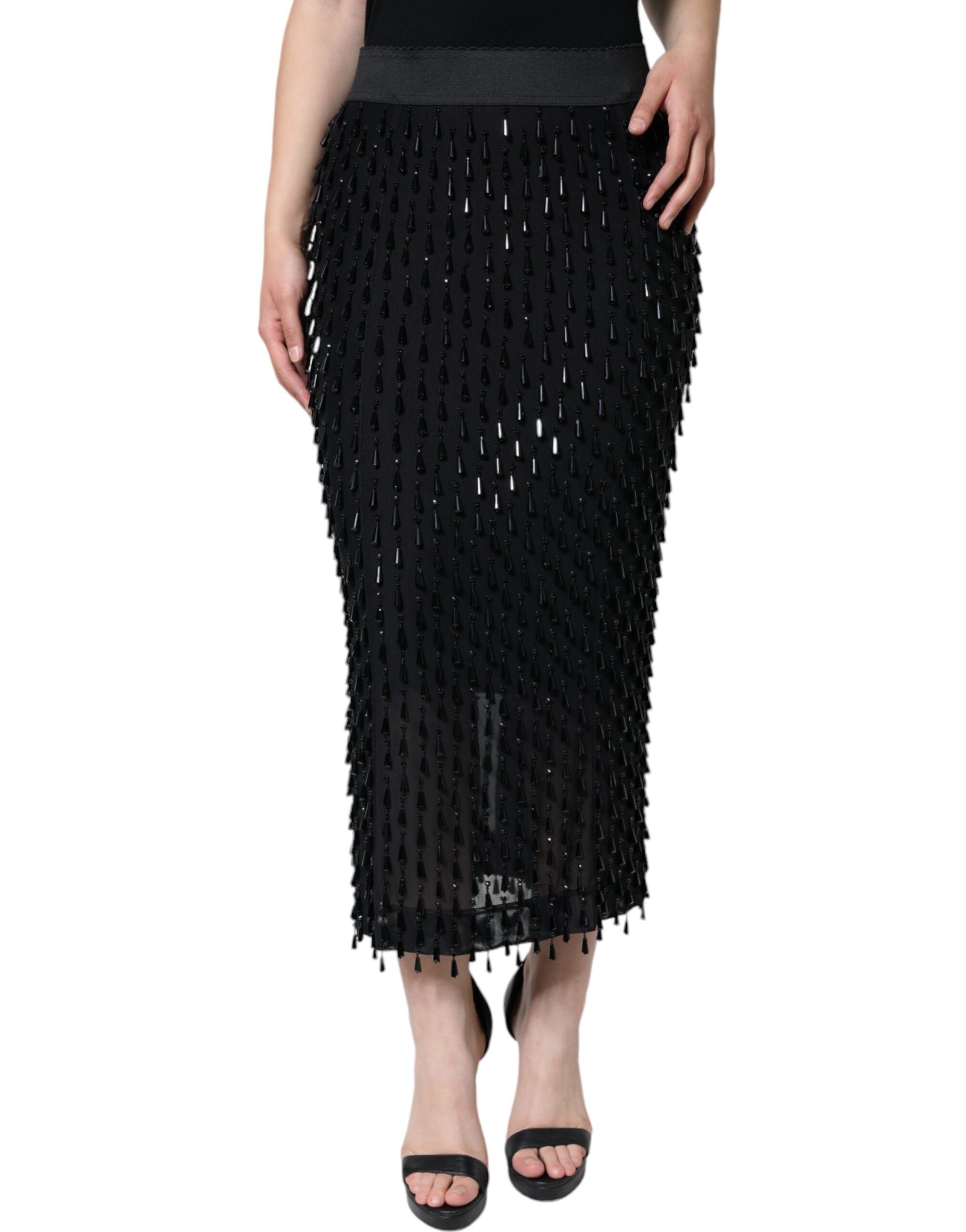 Jupe midi noire Dolce & Gabbana à coupe crayon avec embellissements brillants, vue de face sur un mannequin.