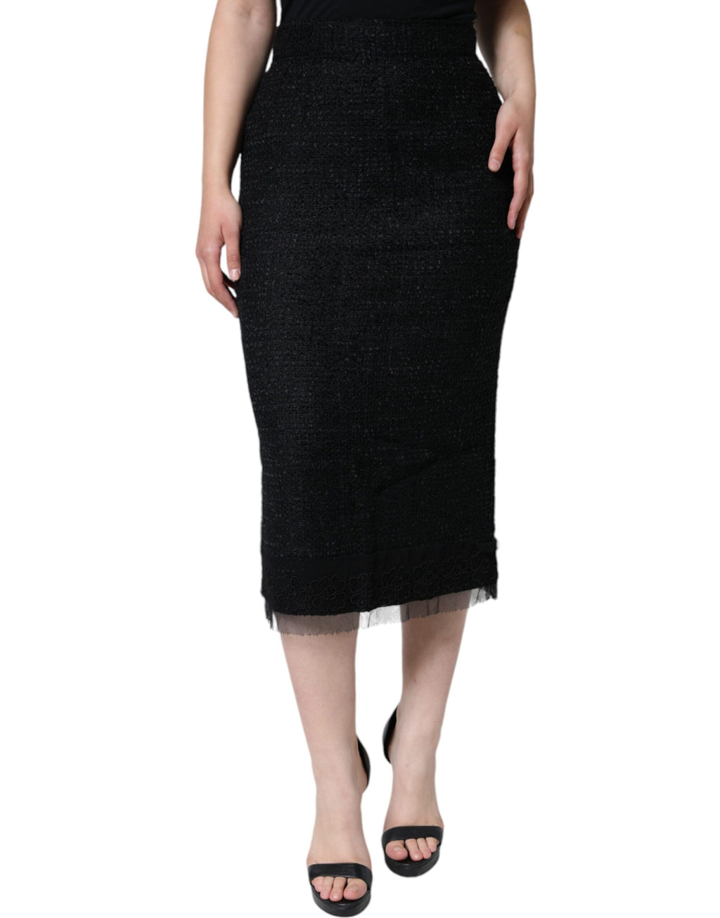 Jupe midi noire en laine vierge Dolce & Gabbana, coupe pencil, tissu élégant, portée sophistiquée.