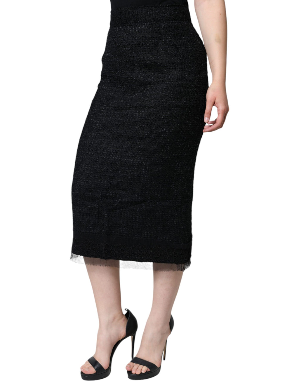 Jupe midi noire en laine vierge à coupe crayon Dolce & Gabbana, élégante et sophistiquée, visible avec une silhouette ajustée.