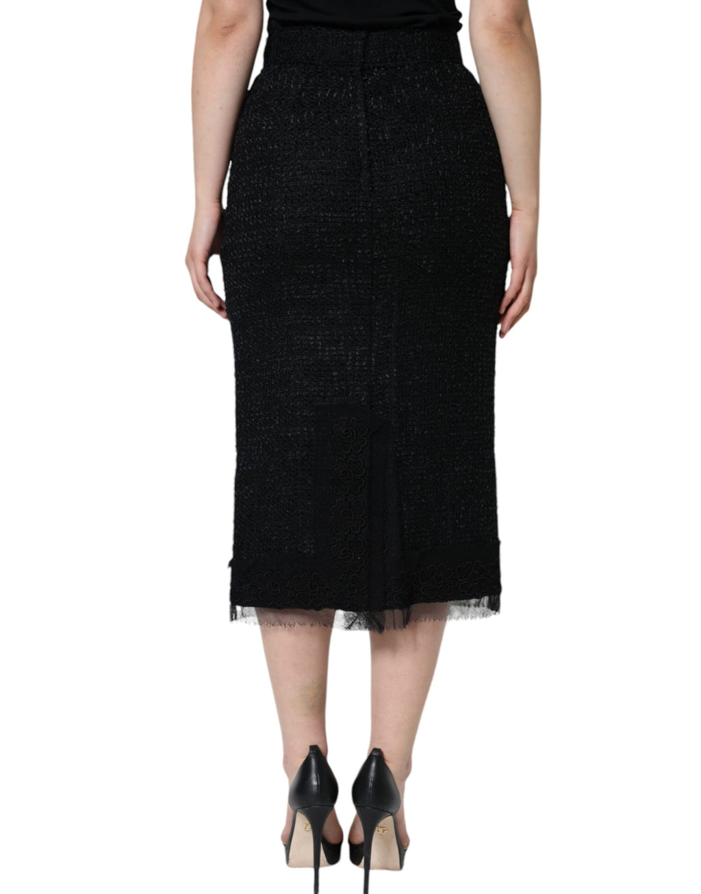 Jupe midi noire en laine vierge à coupe crayon de Dolce & Gabbana, ajustée et élégante, portefeuille de style sophistiqué.