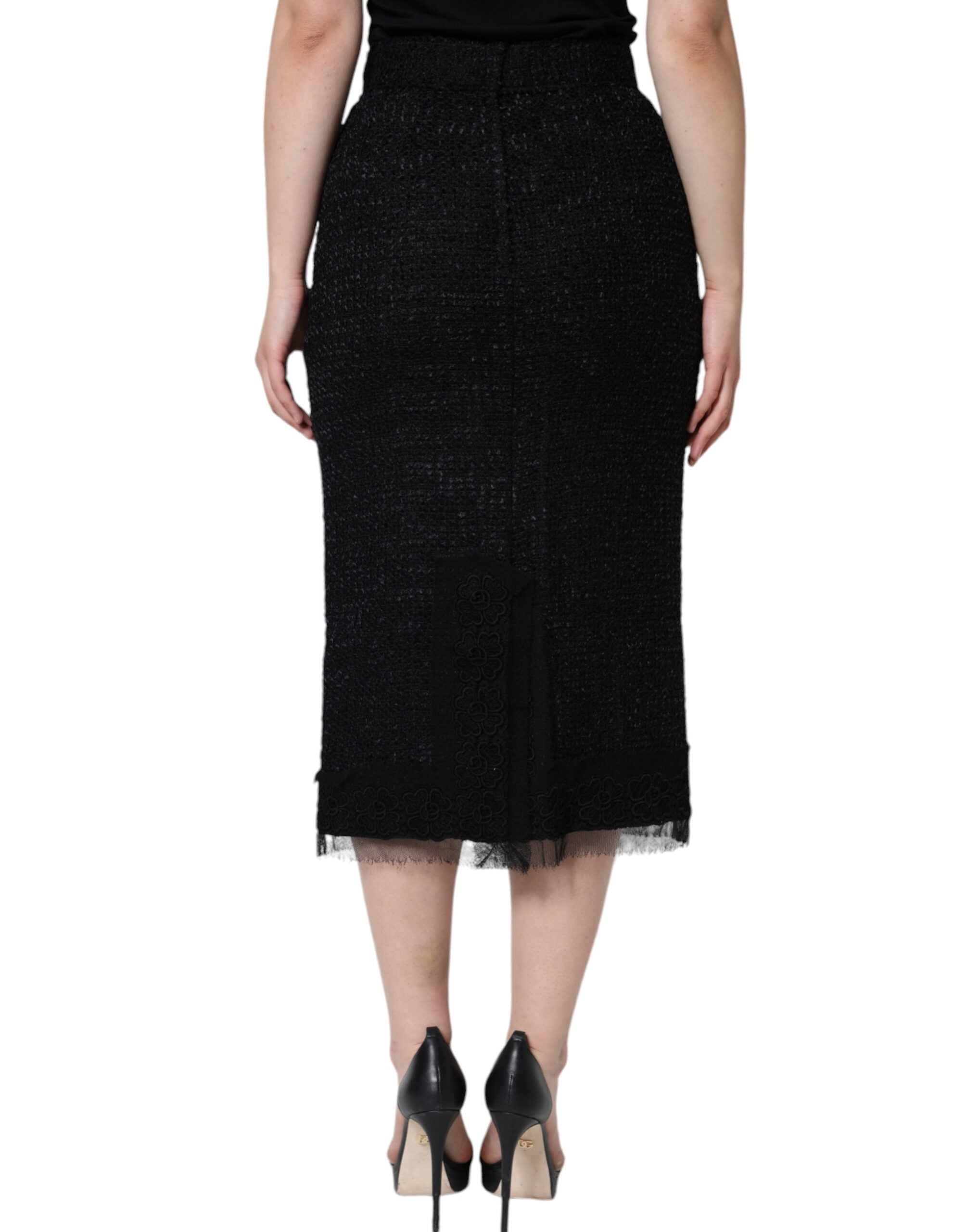 Jupe midi noire en laine vierge à coupe crayon de Dolce & Gabbana, ajustée et élégante, portefeuille de style sophistiqué.
