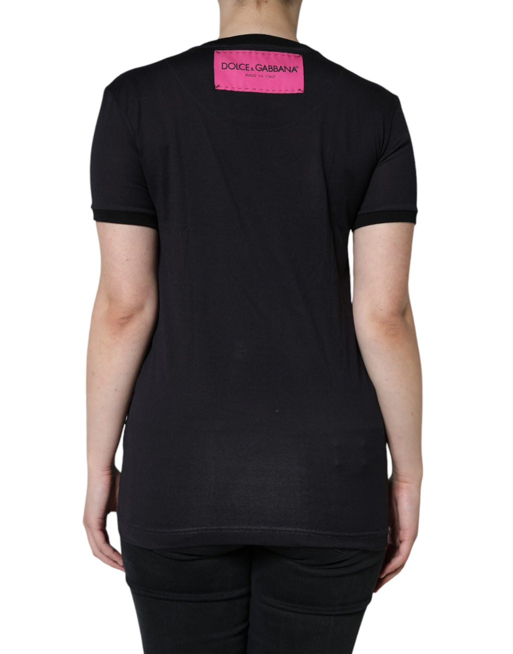 T-shirt rond noir en coton Dolce & Gabbana avec logo imprimé, col rond, visible en gros plan sur fond neutre.