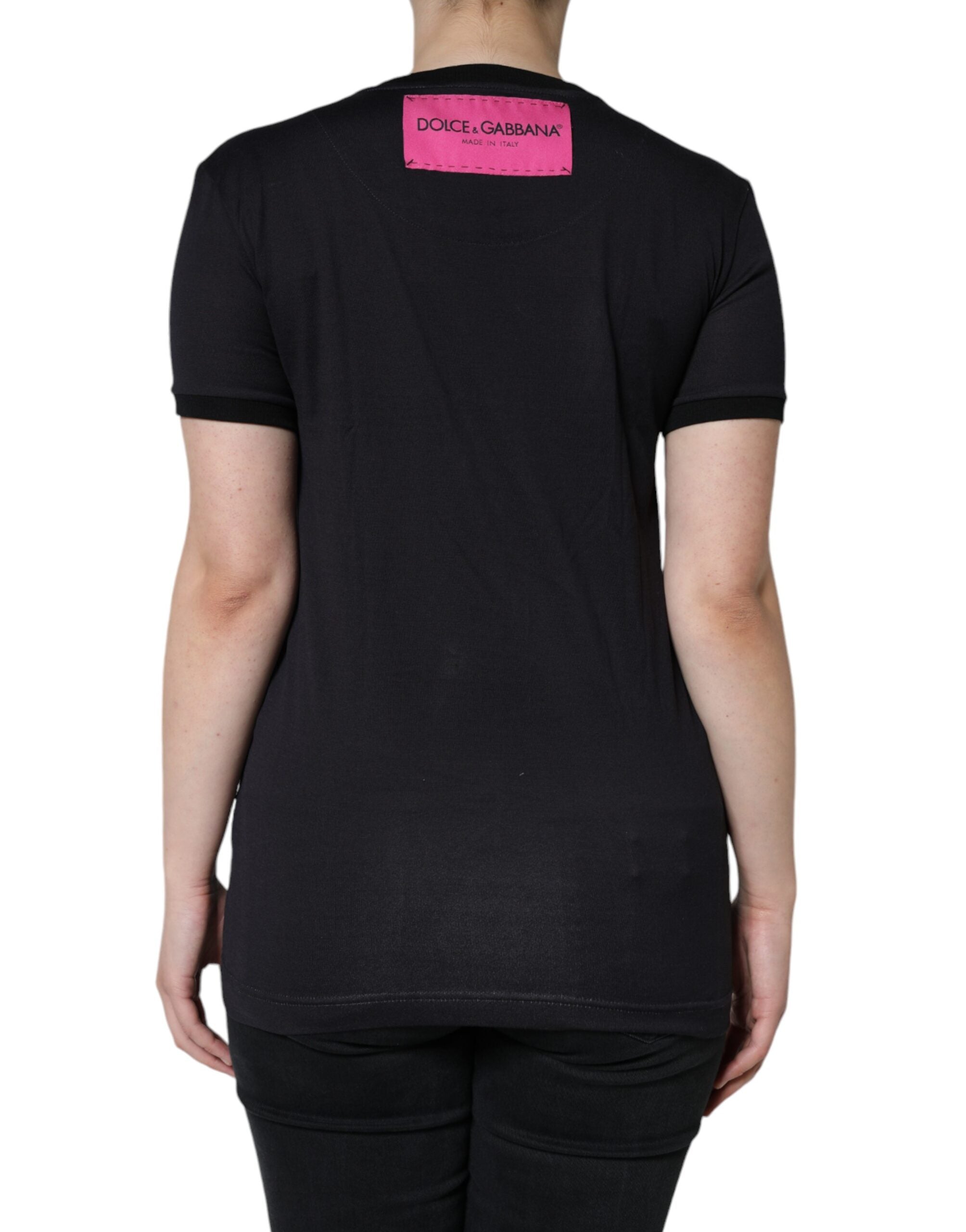T-shirt rond noir en coton Dolce & Gabbana avec logo imprimé, col rond, visible en gros plan sur fond neutre.