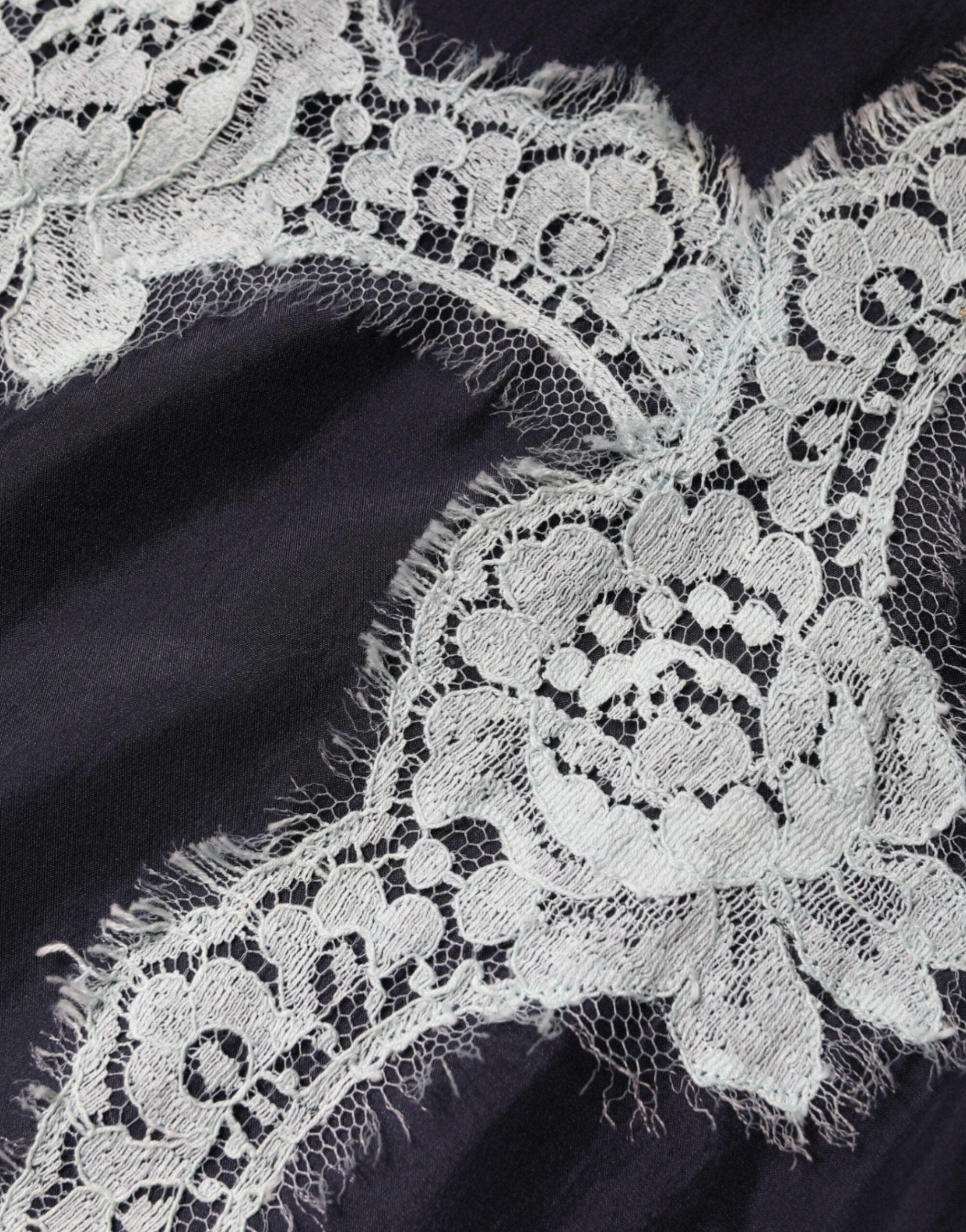 Débardeur en soie Dolce & Gabbana bleu avec dentelle florale sans manches, élégant et léger, pour un style sophistiqué.