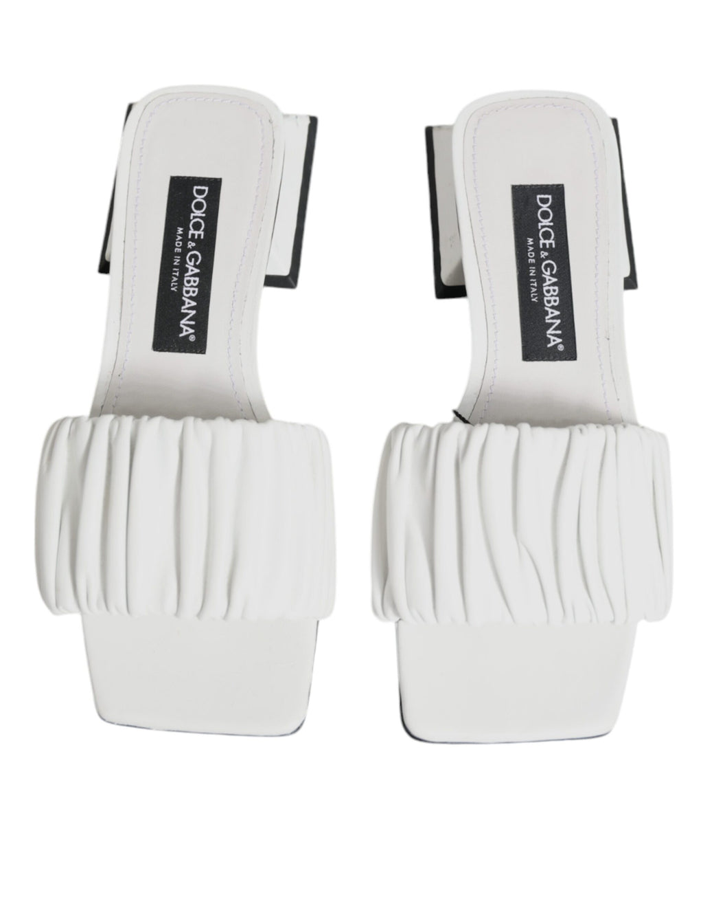 Sandales plates en cuir blanc Dolce & Gabbana, chaussures élégantes et confortables, vues de face sur fond neutre.
