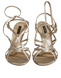 Sandales à talons stilettos en cuir beige de Dolce & Gabbana, chaussures élégantes avec design sophistiqué.