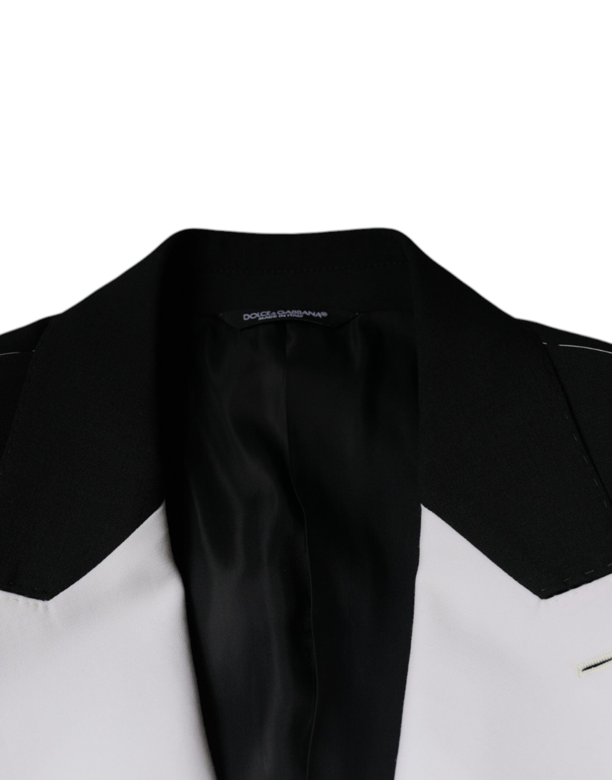 Veste blazer Dolce & Gabbana noire et blanche à un bouton, coupe classique, portée élégante, visible sur l'image.