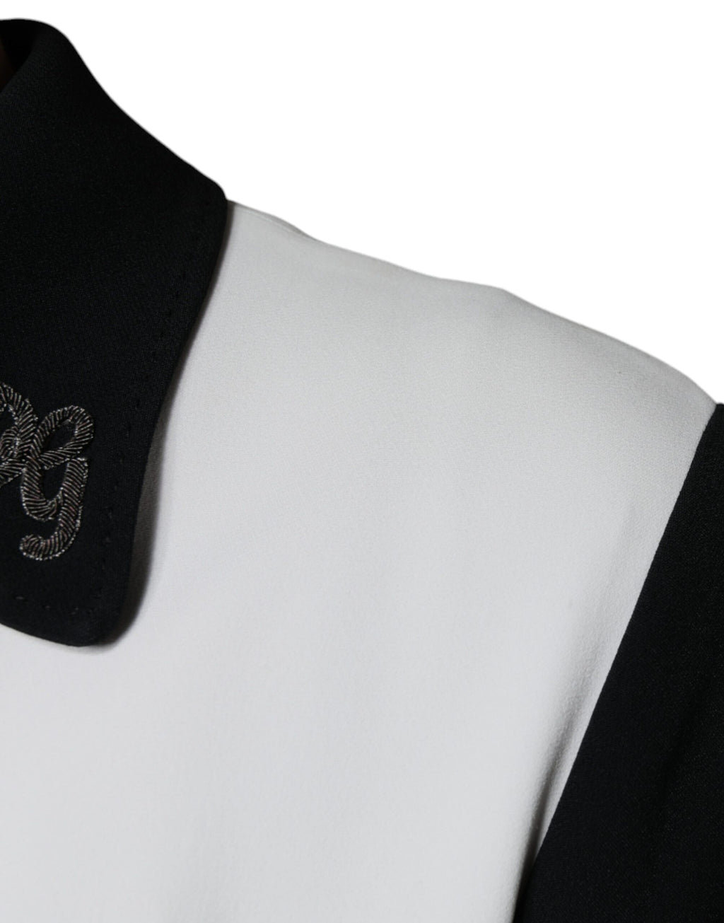 Veste Dolce & Gabbana noir et blanc avec fermeture éclair complète et motif couronne DG, style décontracté et élégant.