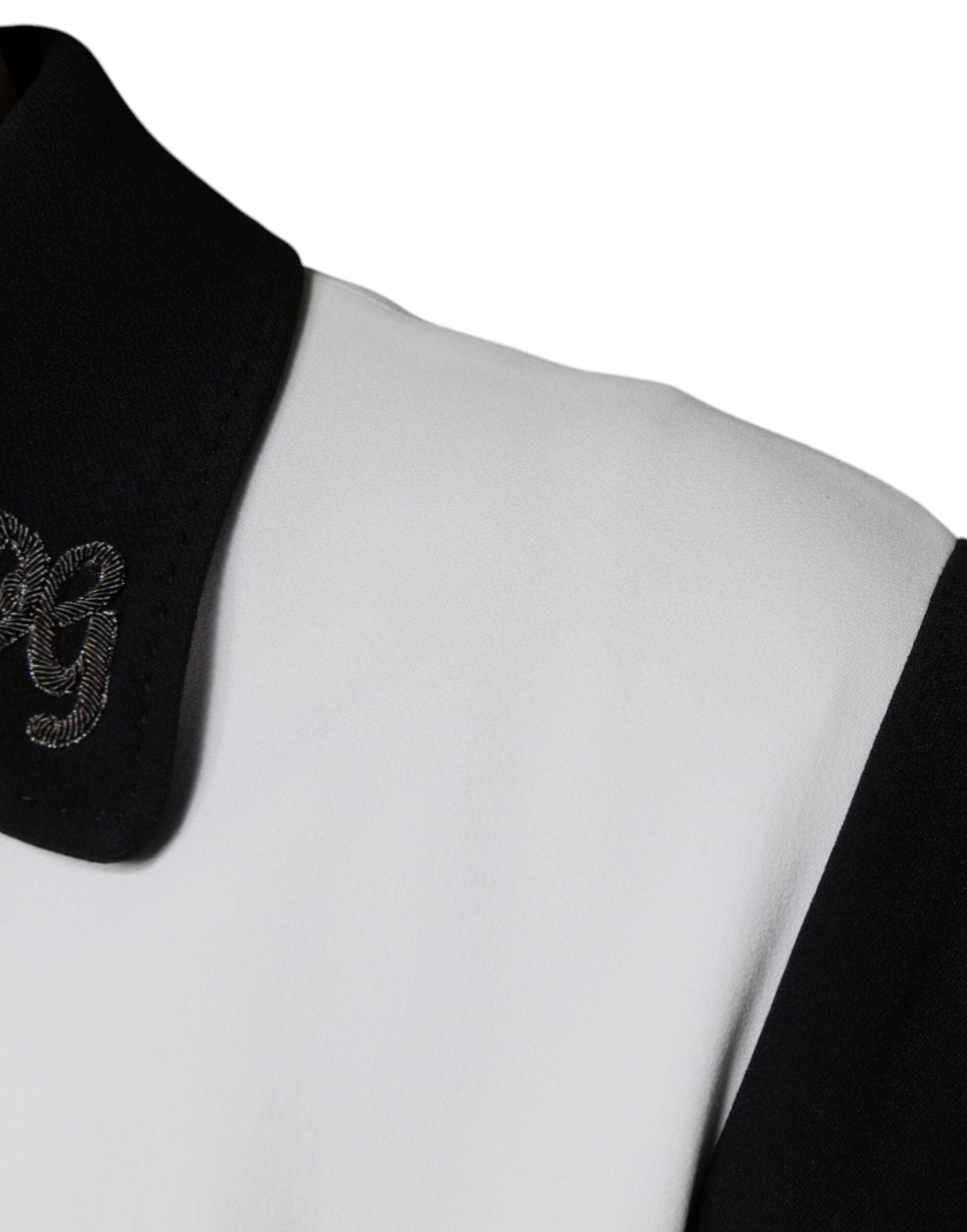 Veste blouson Dolce & Gabbana noire et blanche avec zip complet et logo couronne DG, vue de face.