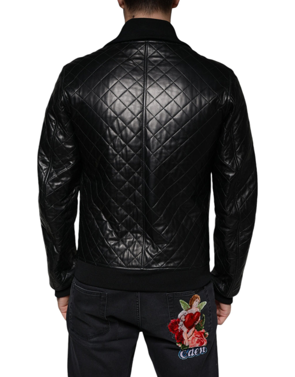 Veste zippée en cuir de veau noir Dolce & Gabbana avec motif matelassé, col haut et design élégant.