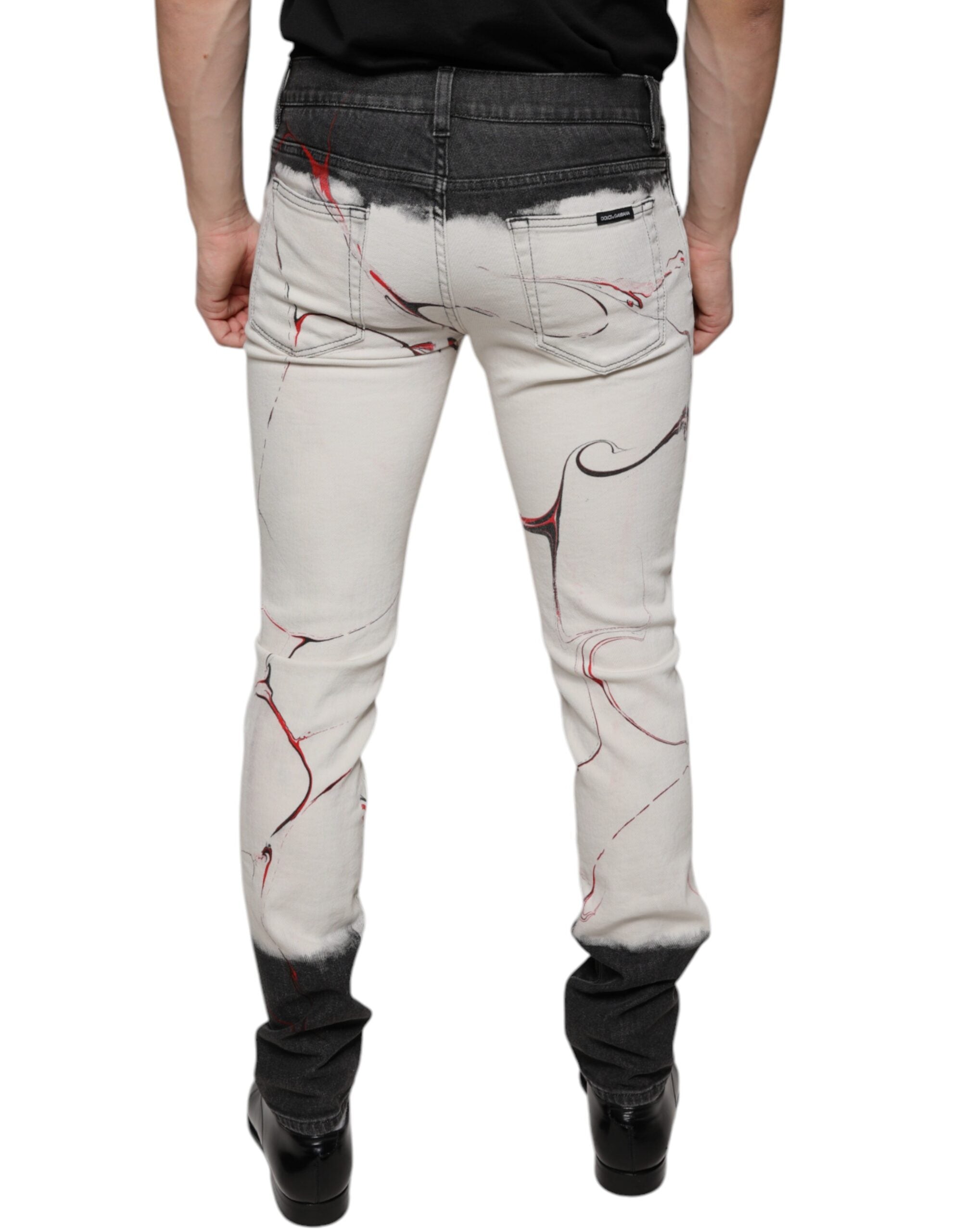 Jeans slim homme Dolce & Gabbana en denim noir et blanc à motifs, ajustés et tendance.