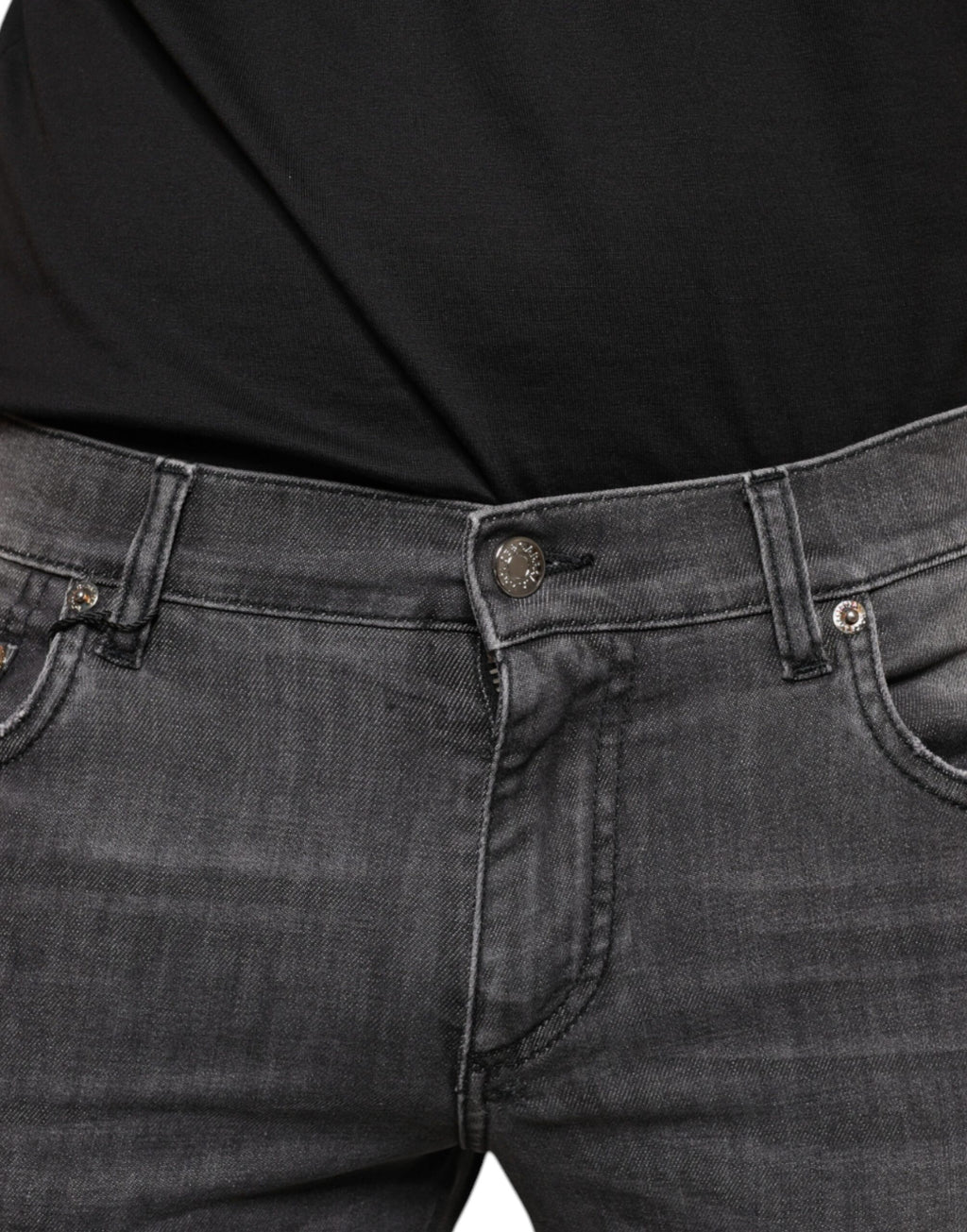 Jeans slim en denim noir tacheté pour homme de Dolce & Gabbana, coton déchiré et style contemporain.