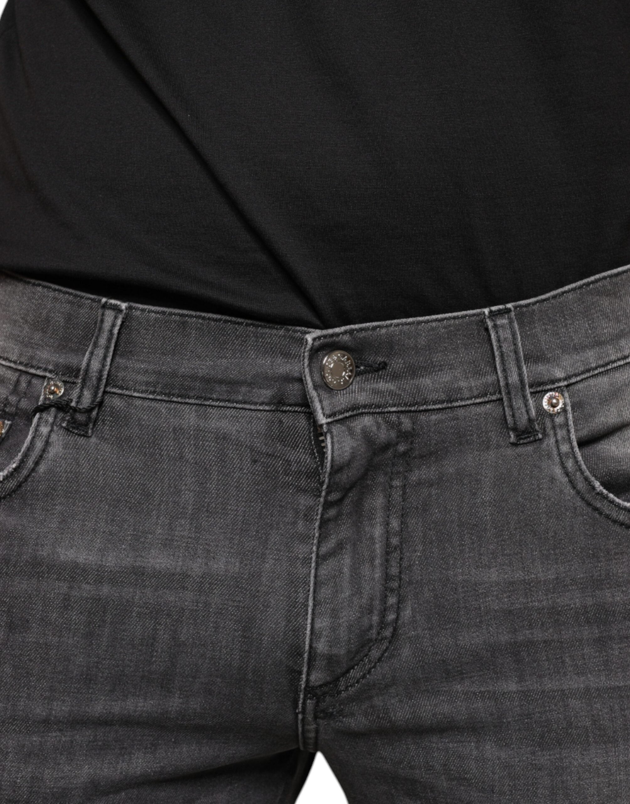 Jeans slim en denim noir tacheté pour homme de Dolce & Gabbana, coton déchiré et style contemporain.