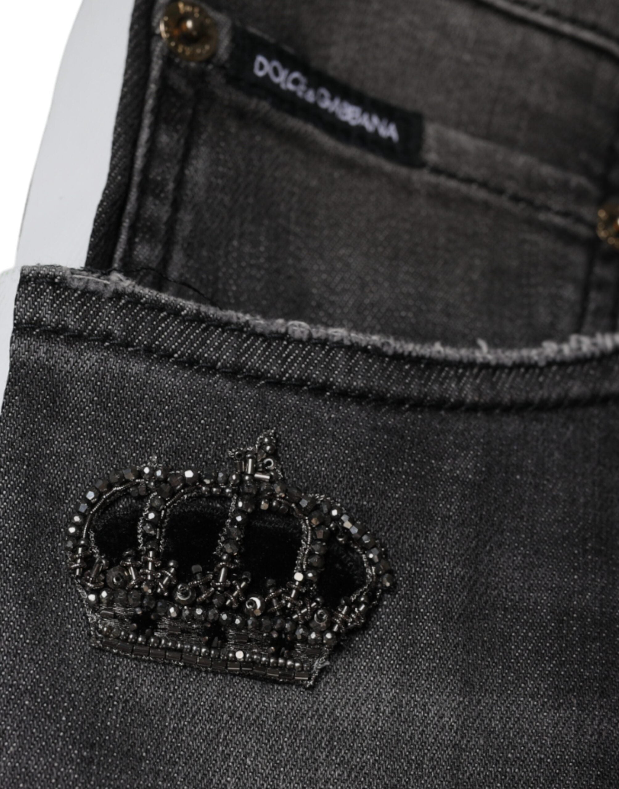 Jeans slim en denim noir tâté avec déchirures en coton de Dolce & Gabbana pour homme, mode tendance et élégante.
