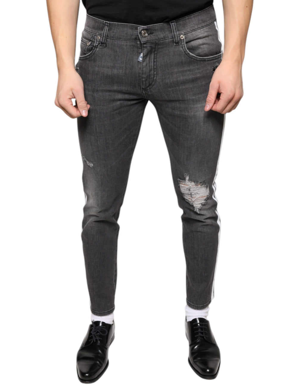 Jeans slim en coton déchiré noir de Dolce & Gabbana pour homme, style skinny avec détails usés et déchirés.
