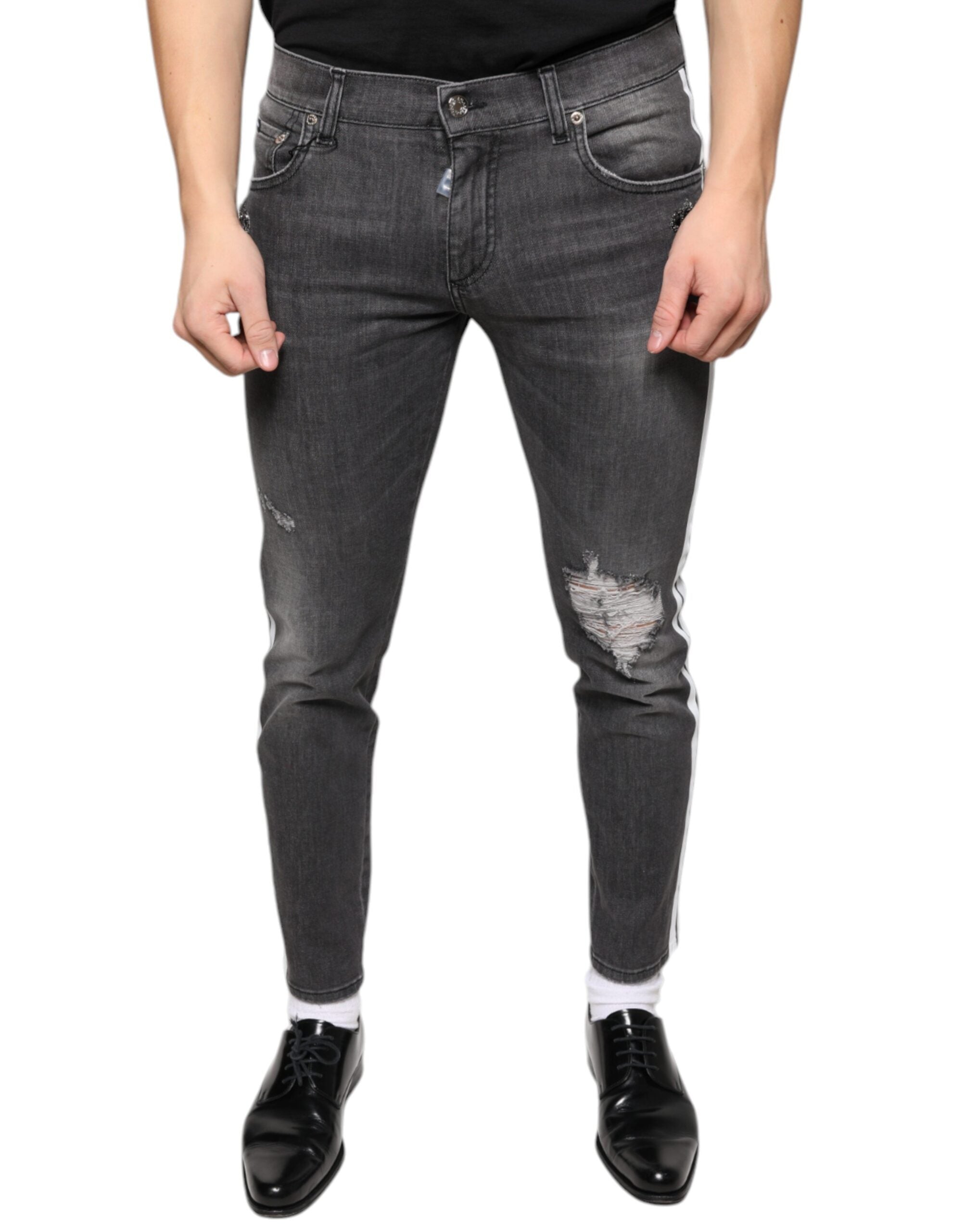 Jeans slim en denim noir Dolce & Gabbana pour homme avec déchirures en coton tissé, ajustés et modernes.