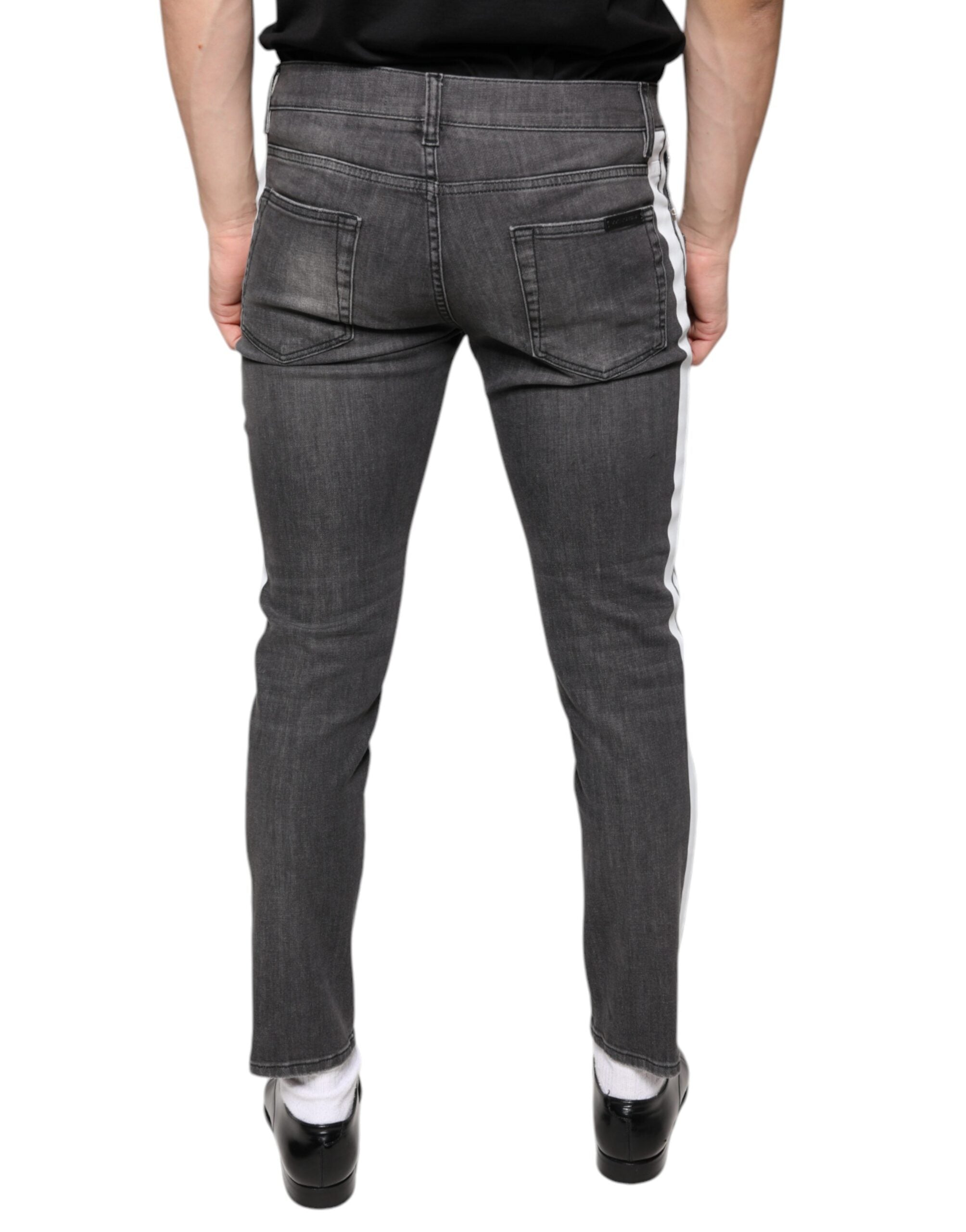 Jeans slim en coton déchiré noir de Dolce & Gabbana pour homme, style décontracté et tendance.
